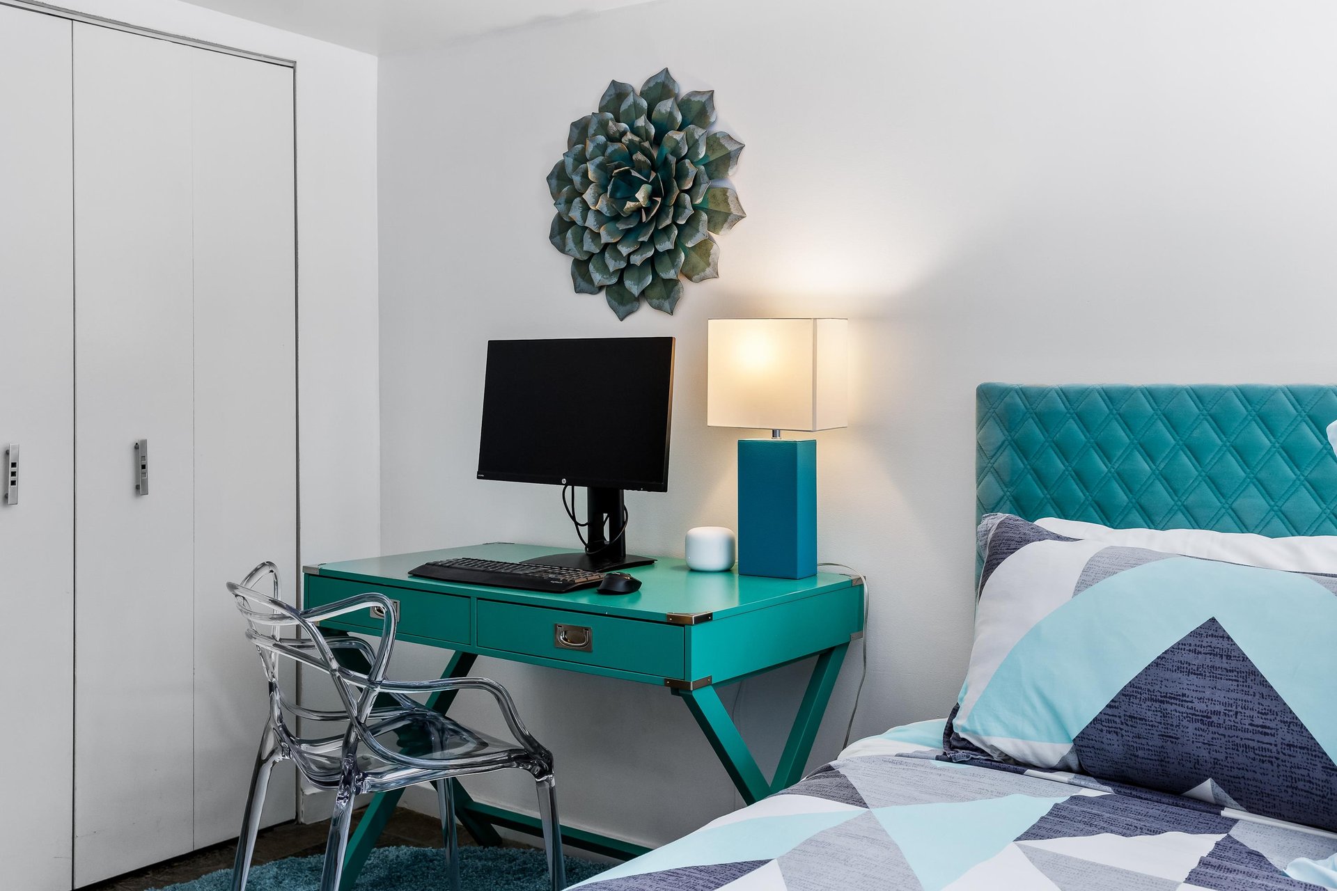 Calming shades of blue and teal decorate this guest bedroom