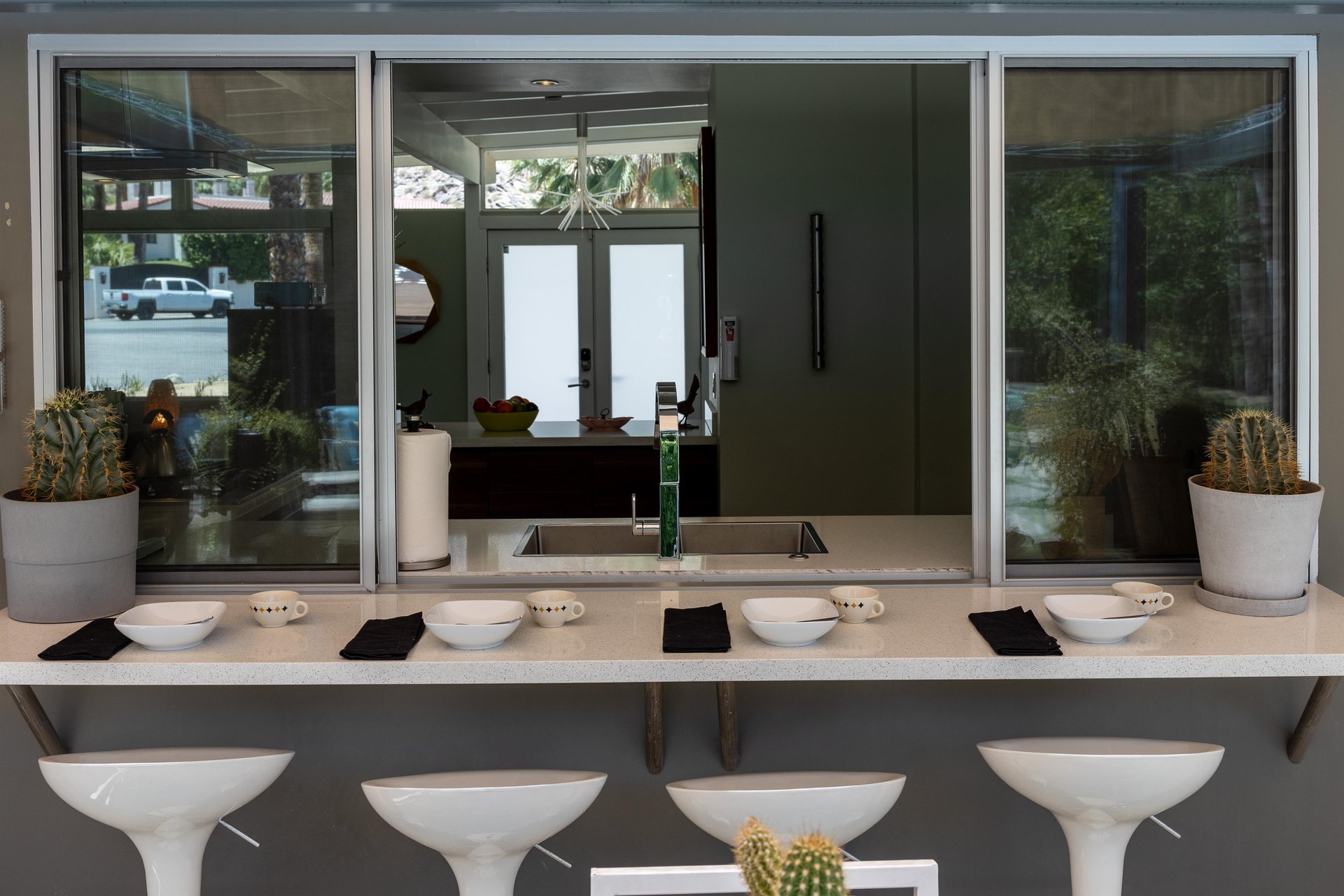 Pass through outdoor dining with barstools