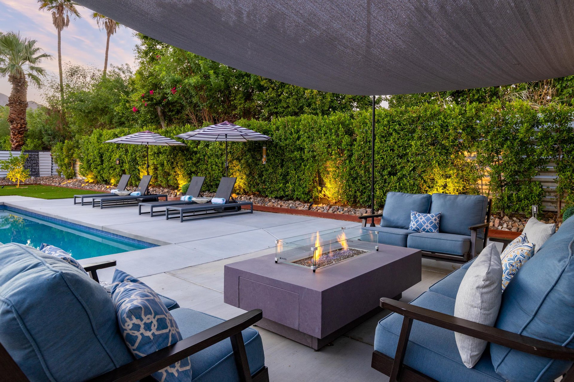 Covered fire pit with comfy lounge chairs