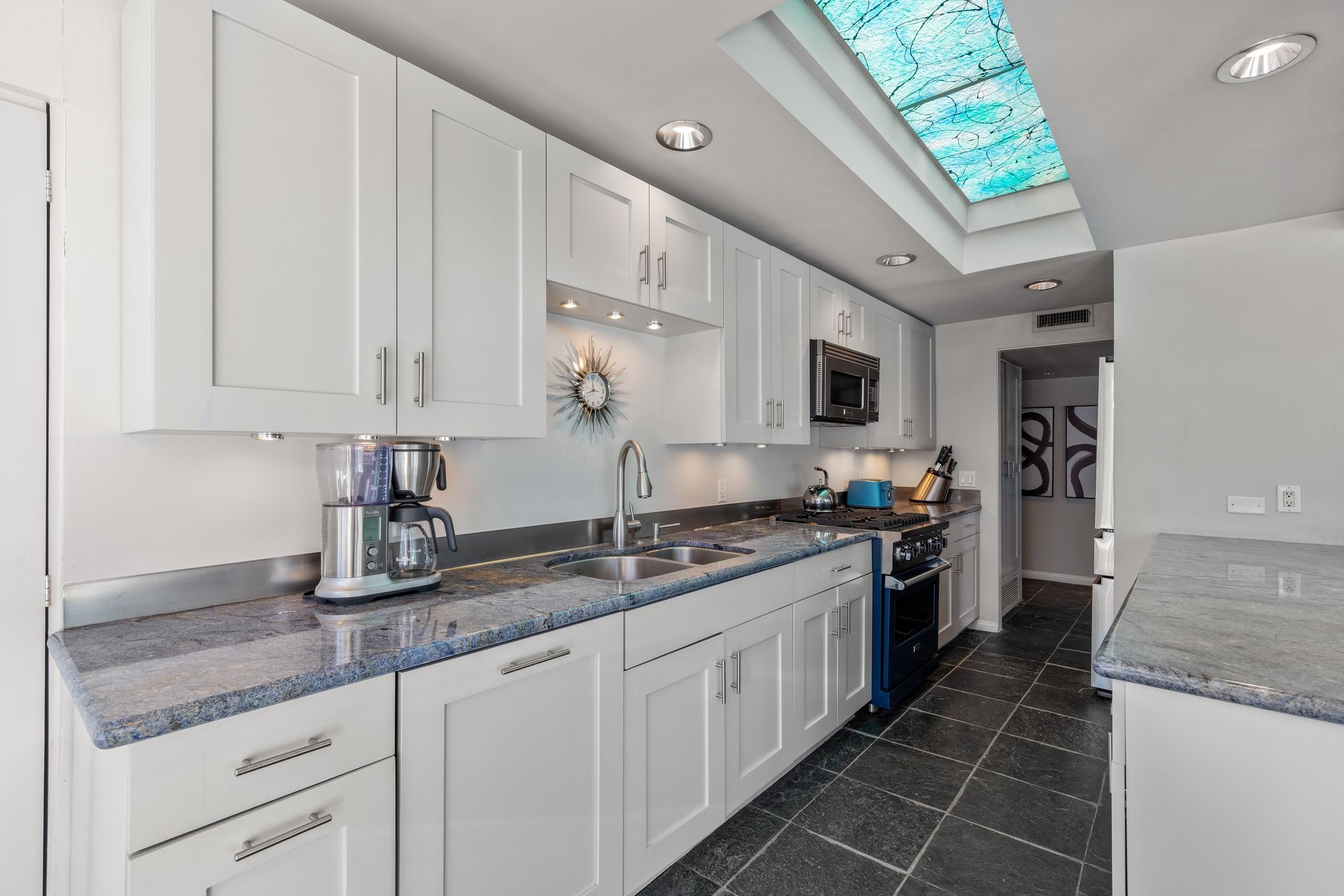 Modern appliances including a Viking stove and Dacor refrigerator