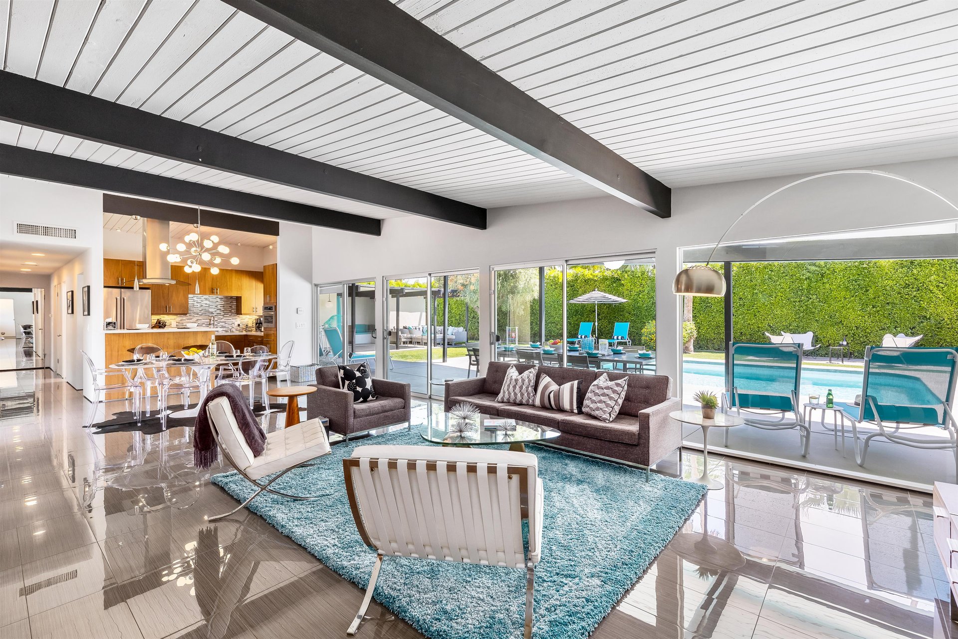 Living room with walltowall backyard views