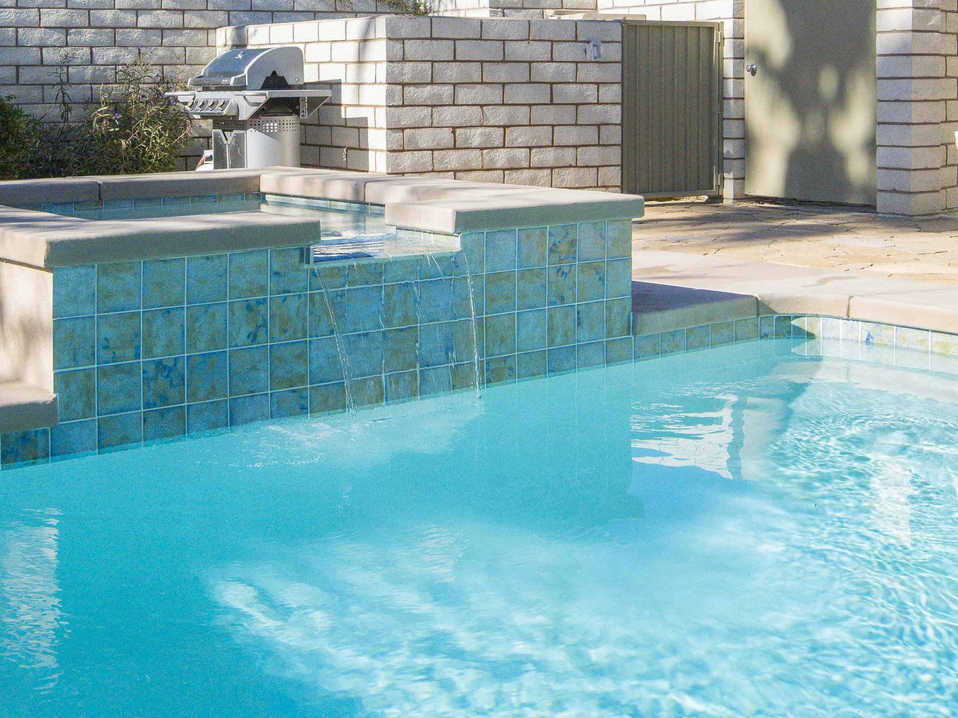 Integrated waterfall spa