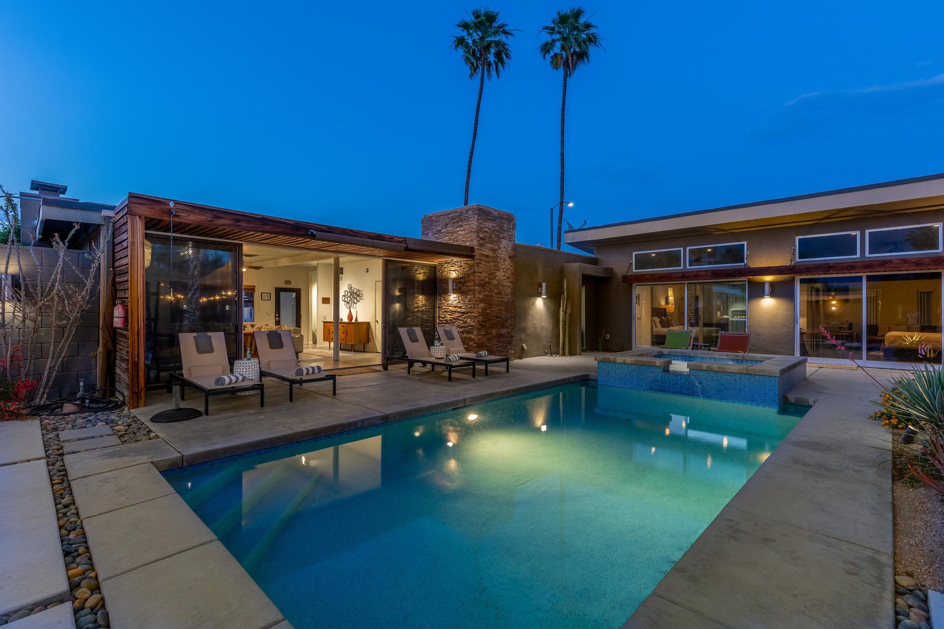 View from the yard overlooking the pool and home