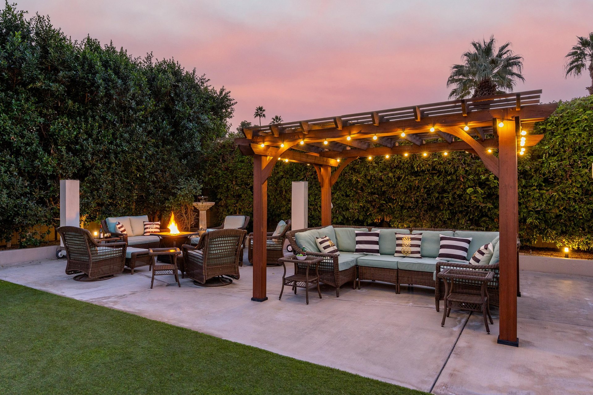 Twinkle lights add a festive feel to this lounge area