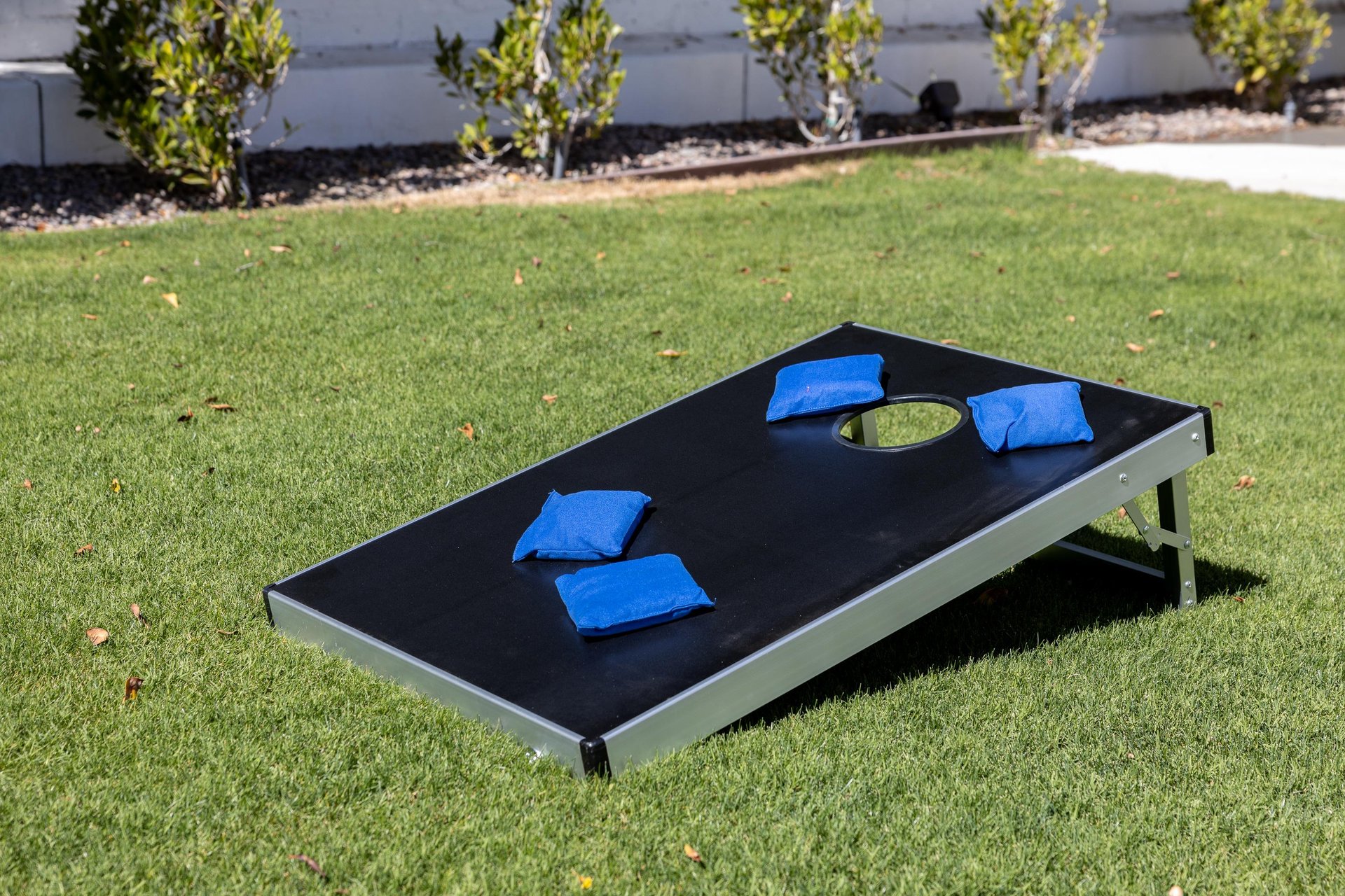 Play a game of cornhole