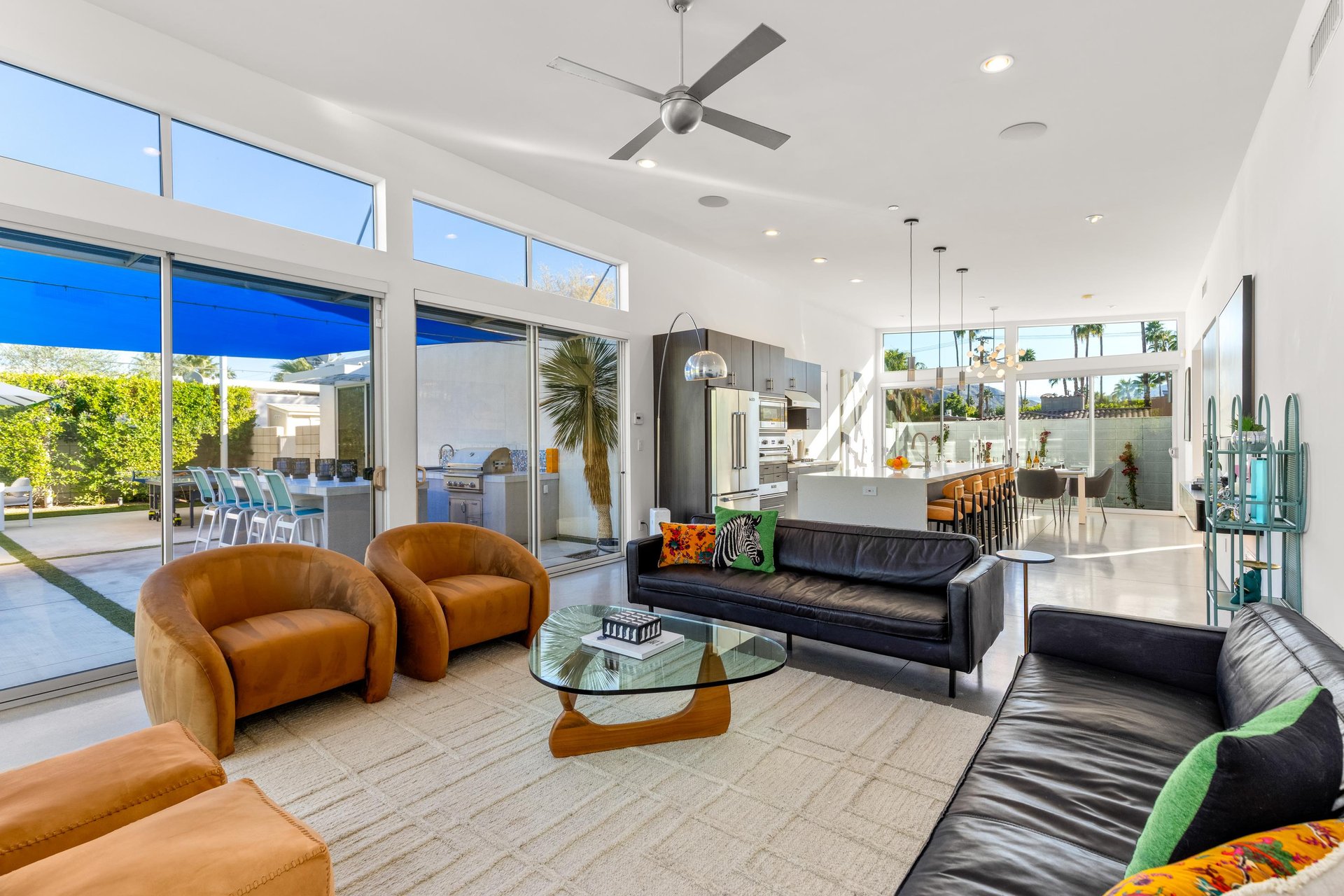 Open concept design with walls of glass to the outdoor areas