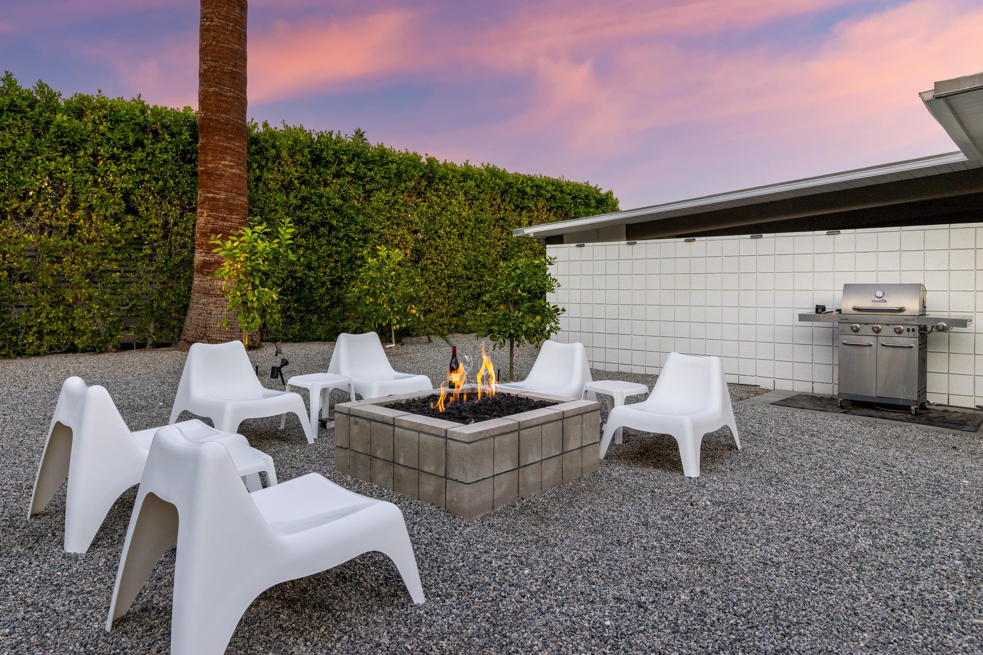 Gather around your private fire pit on the patio while the grill awaits your next barbecue adventure.