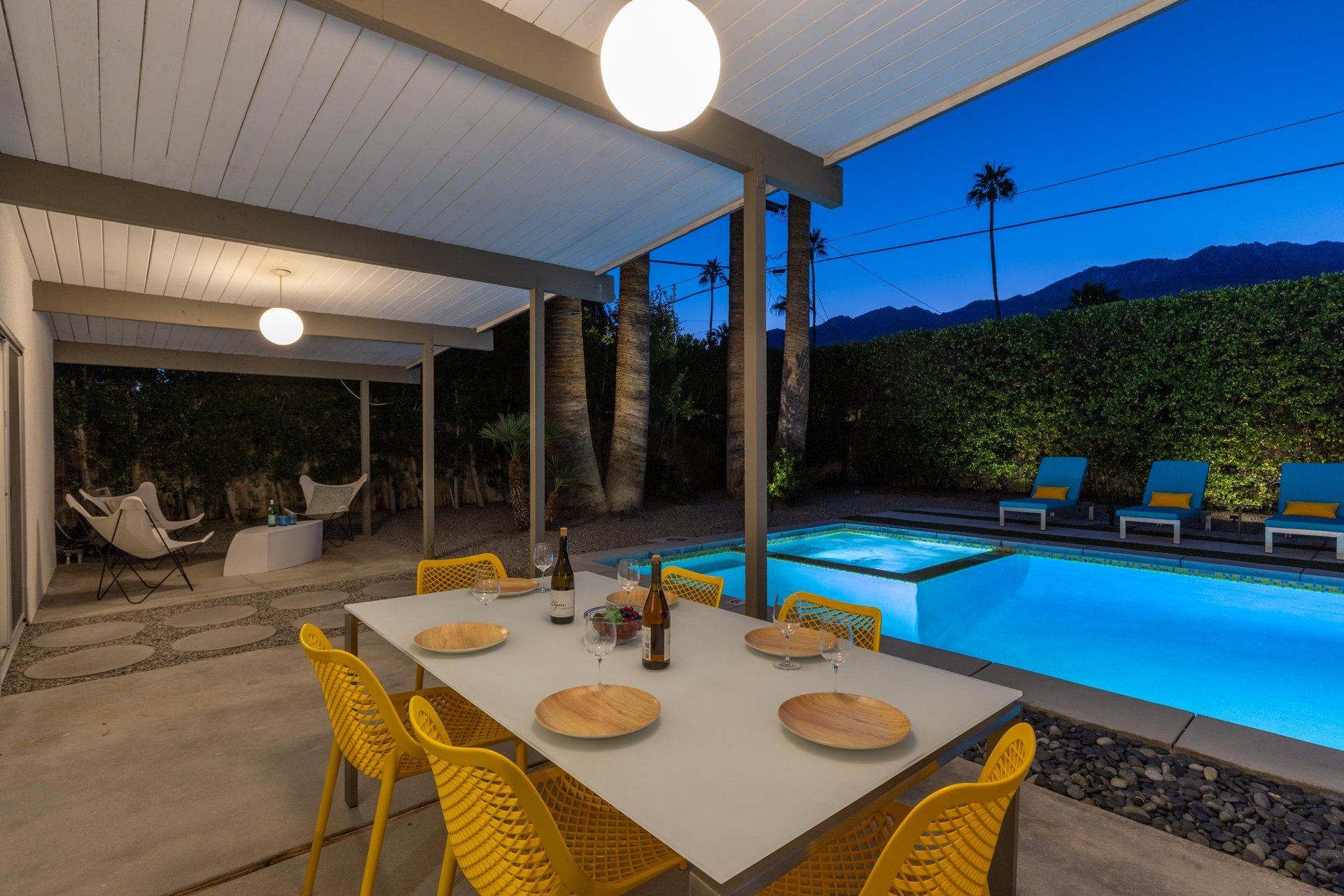 Dine al fresco under soft lighting while your private pool glows invitingly nearby, mountains creating a stunning backdrop for unforgettable evenings.