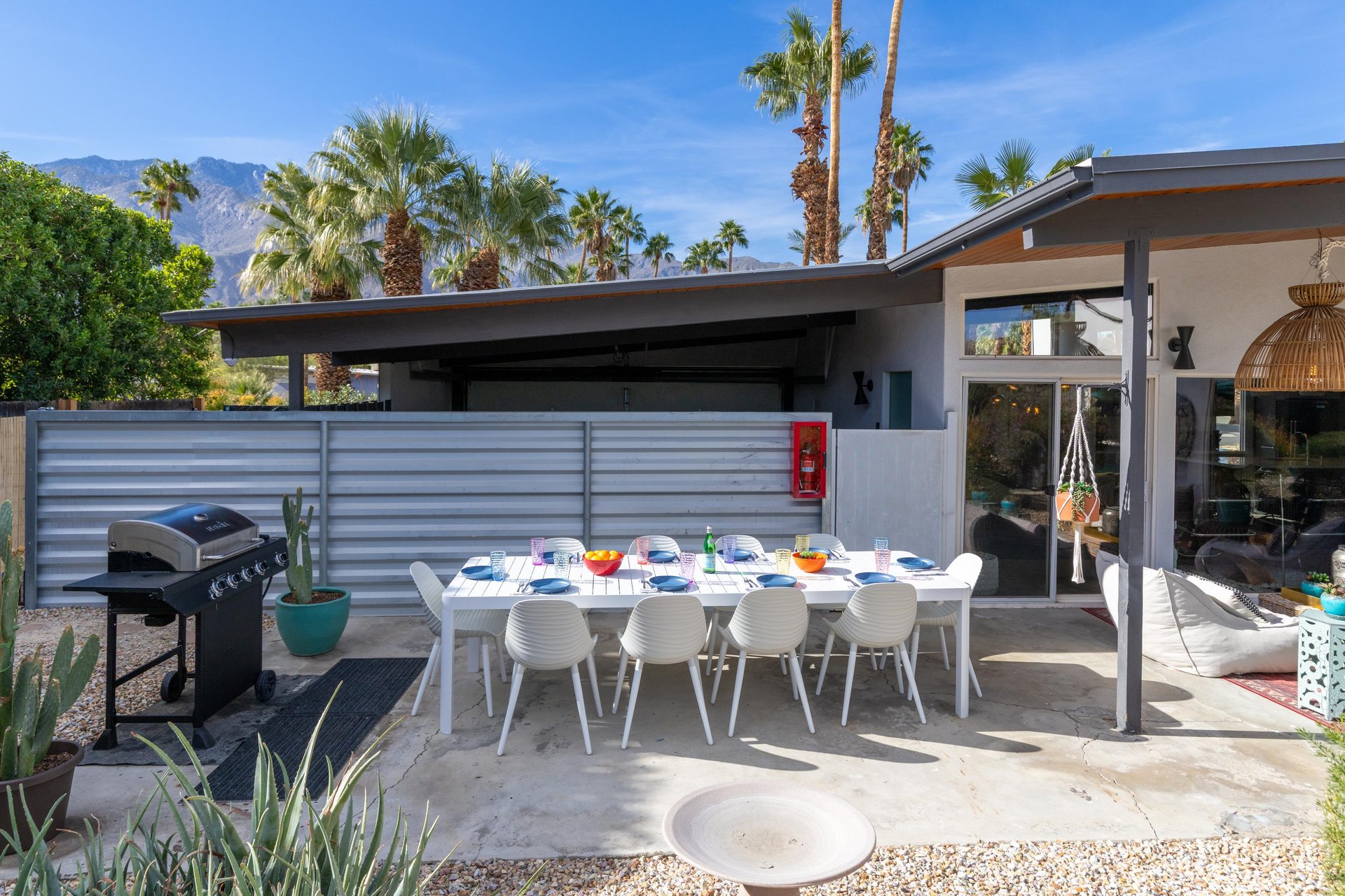 Step out to your private patio where desert mountains frame outdoor dining under swaying palms, perfect for memorable meals together.