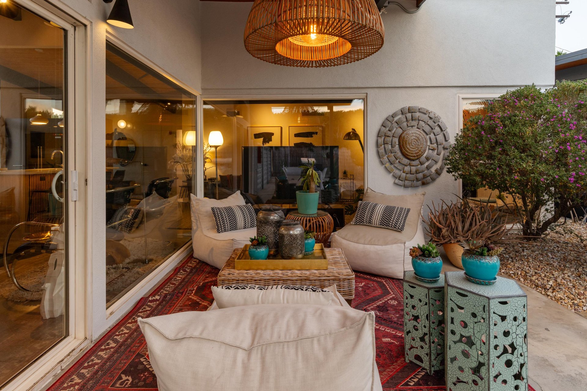 Unwind in your private patio oasis, where plush seating and warm lighting create the perfect spot for evening relaxation.