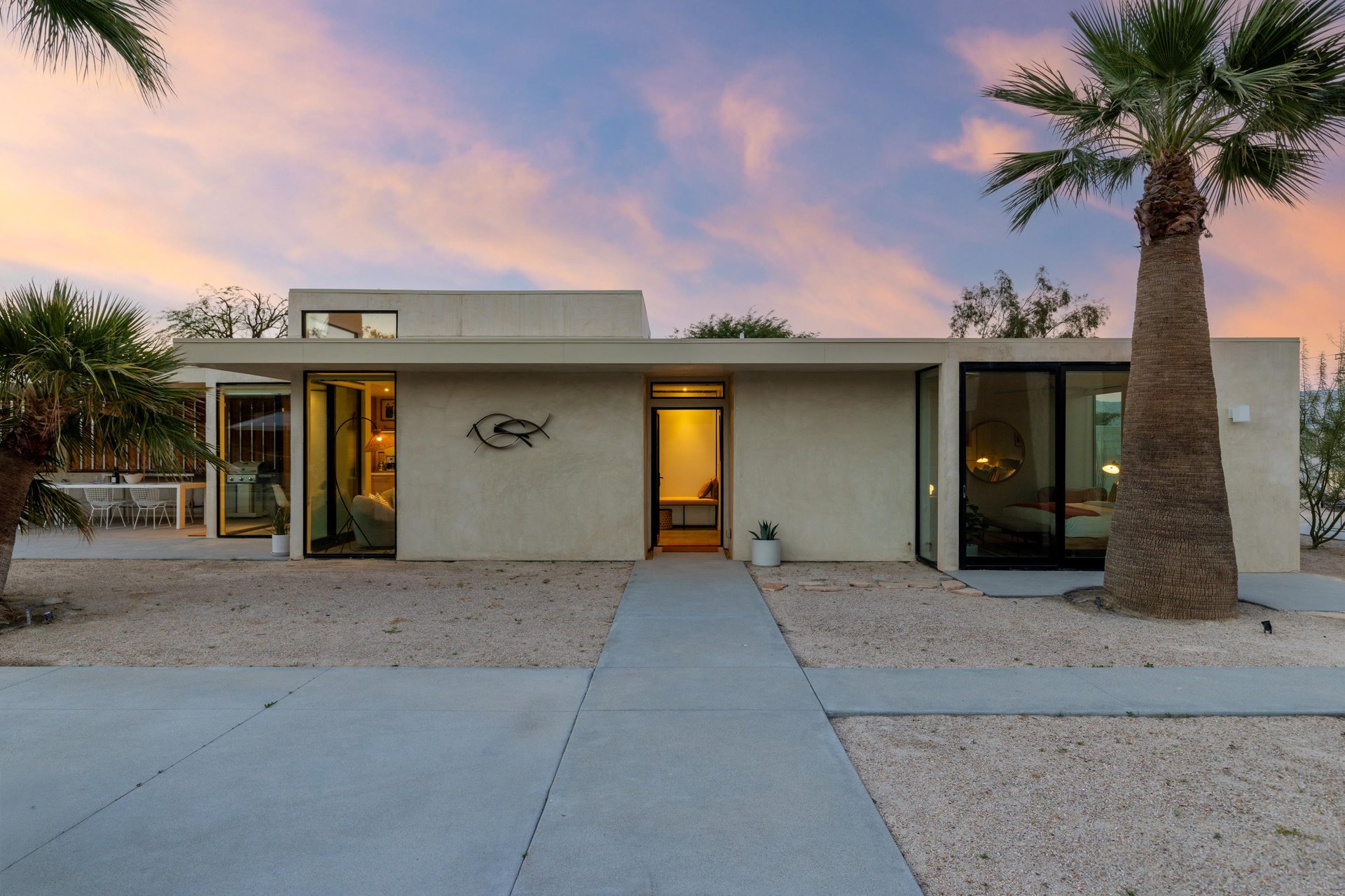 Sleek architecture framed by swaying palms