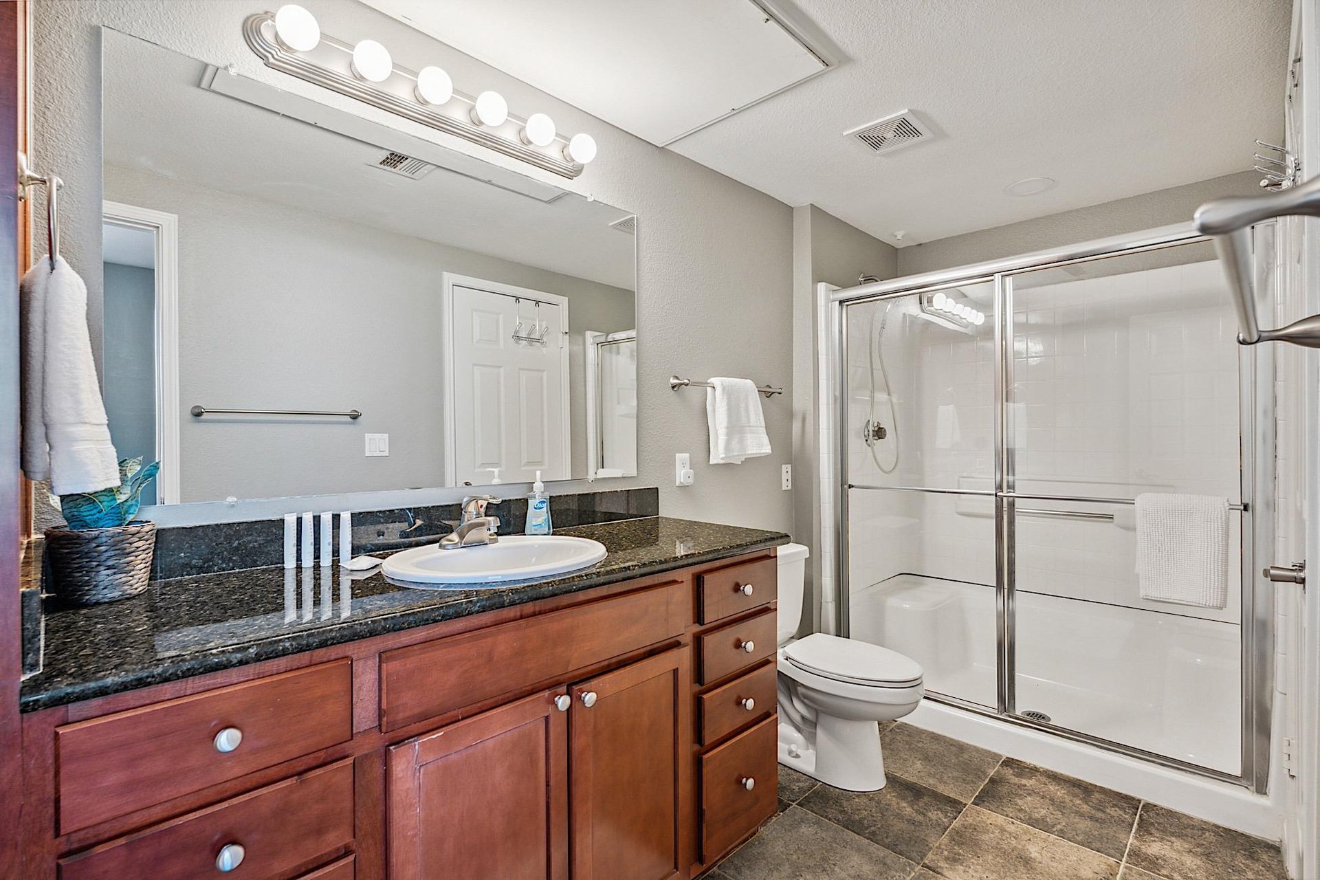 Second bathroom  single vanity  walkin shower.