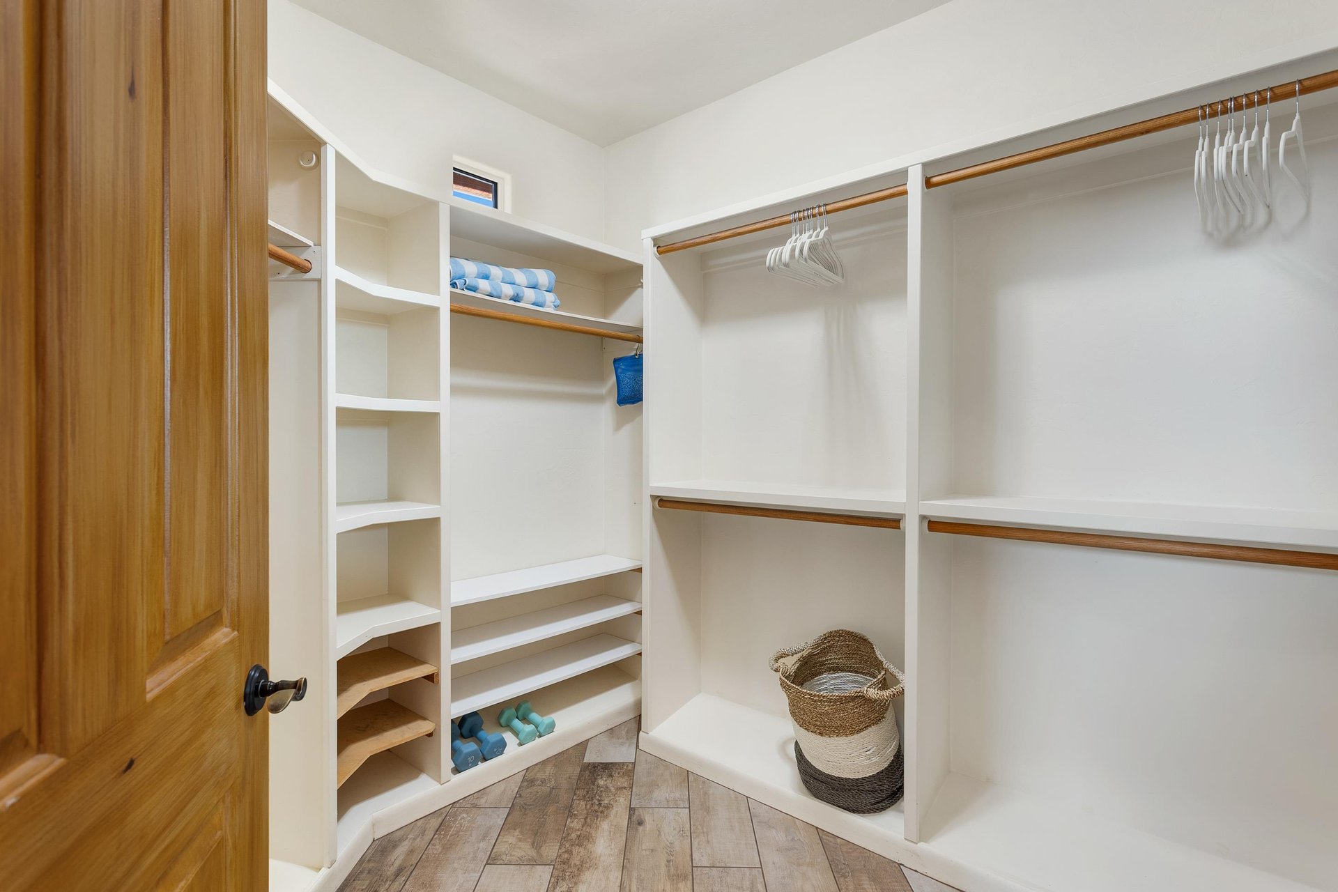 large walk in master bedroom closet