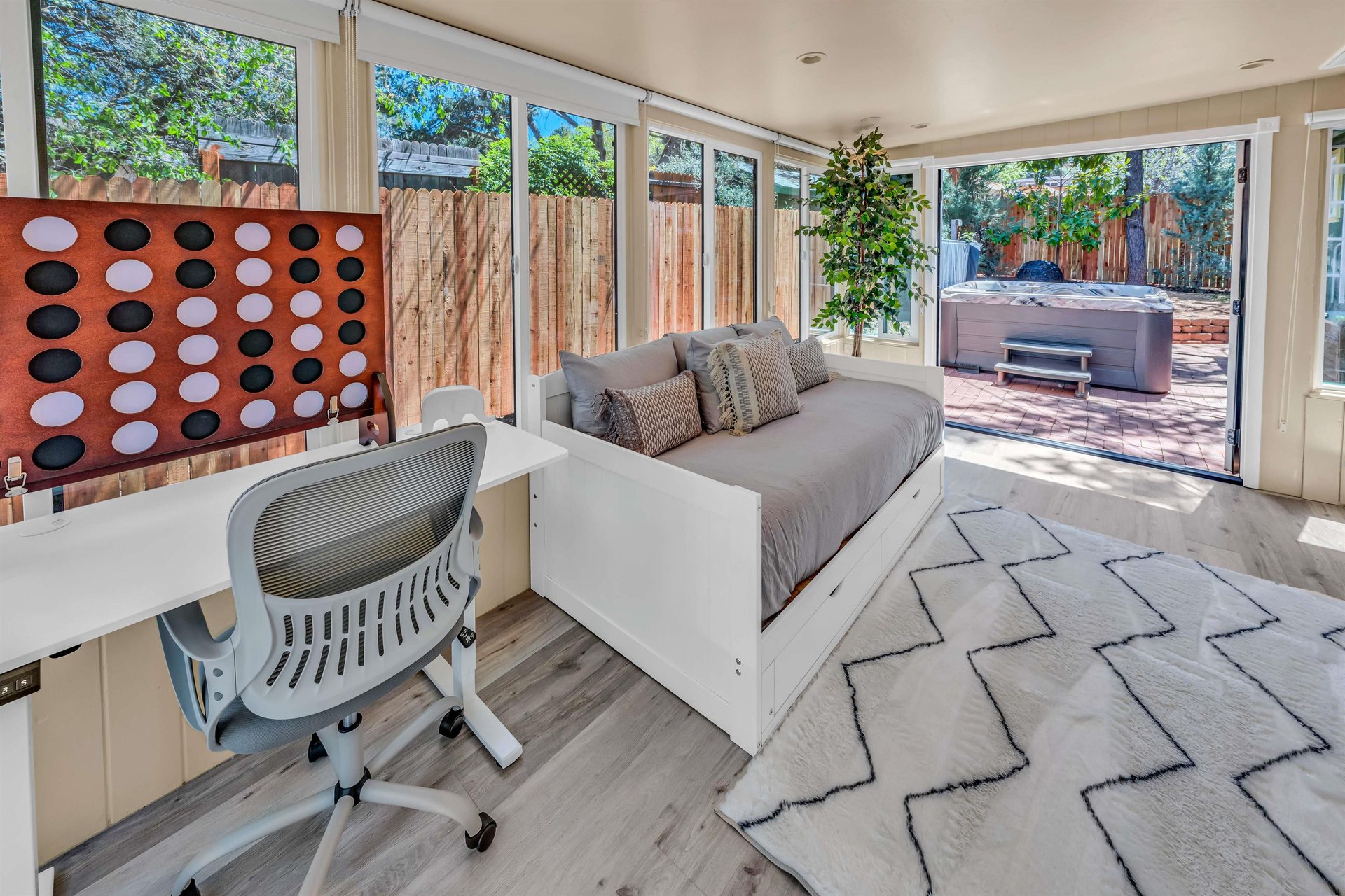 Extra Sleeping Area With All New Wall To Wall Windows. Black Out Curtains Are Provided. This Area Is Near Entrance To Home And Not Considered A Bedroom