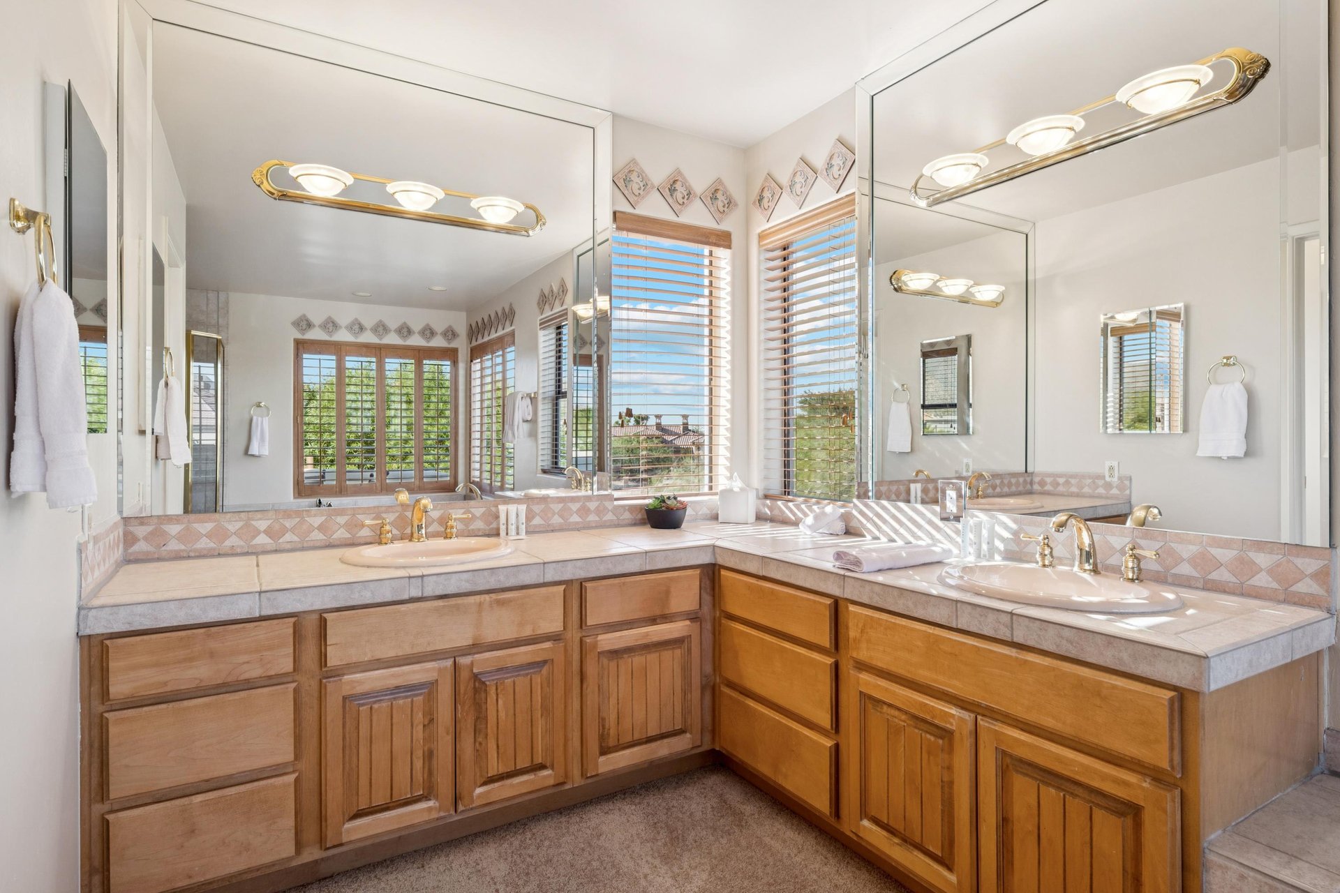 Upstairs primary bedroom with spacious vanity.