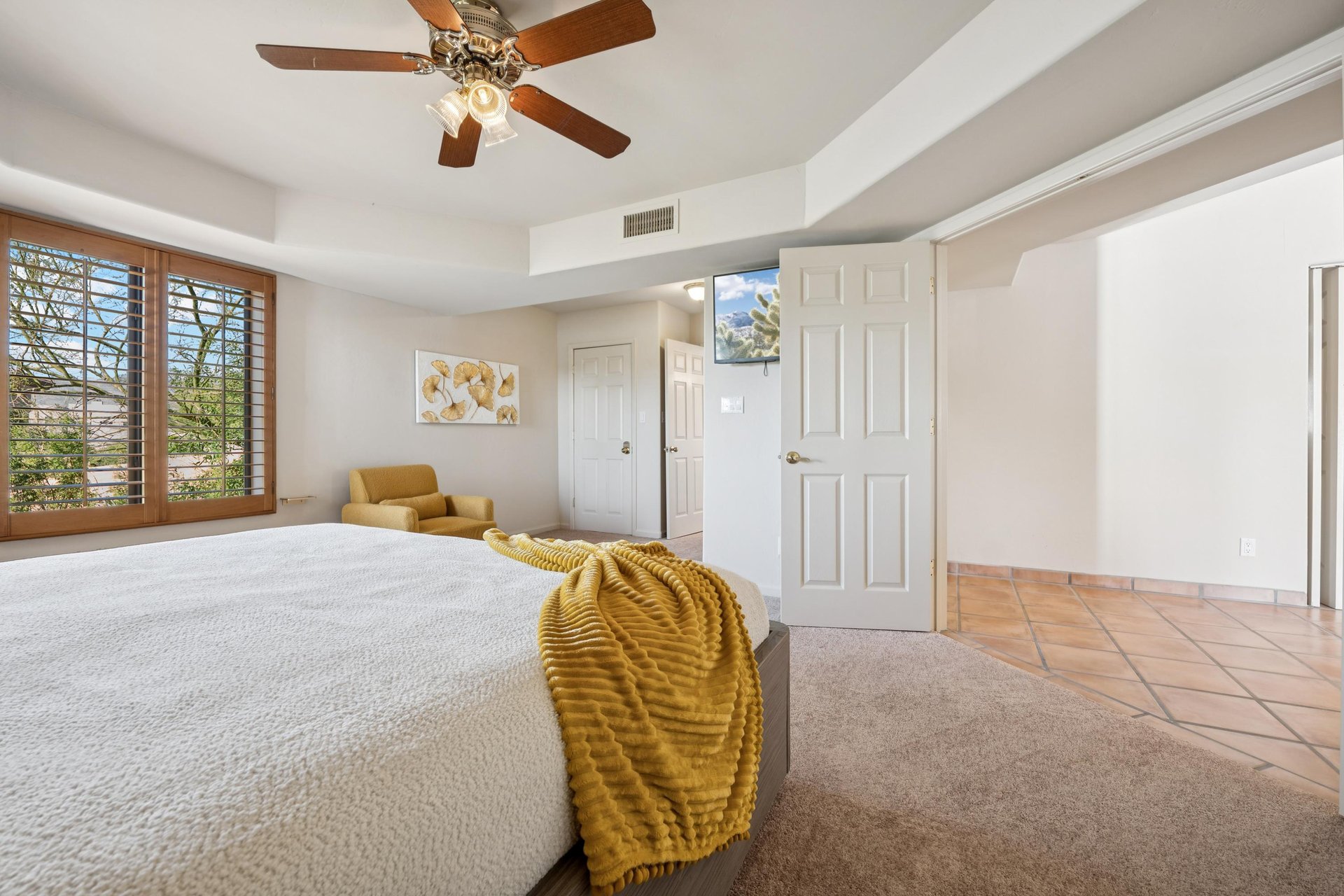 Downstairs guest bedroom with king side bed.