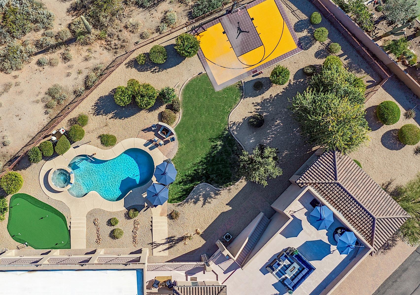 Aerial view of backyard and rooftop patio