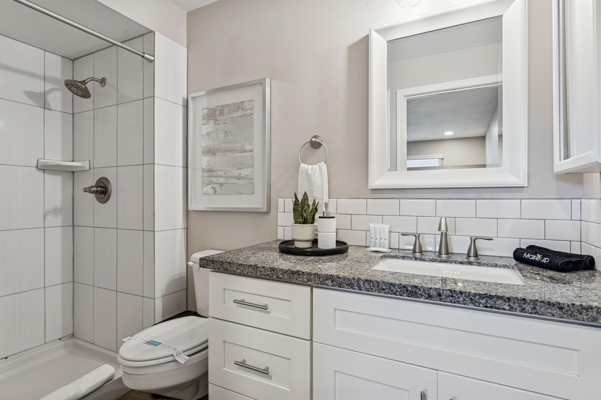 Primary bathroom with spacious walk in shower.