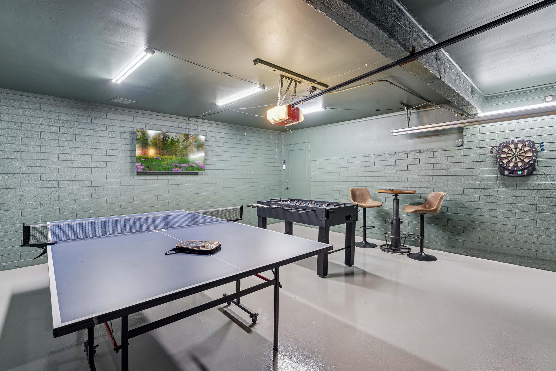 Watch your favorite show on the 85 inch flat screen TV while competing in a gave of ping pong, Foosball, and darts.
