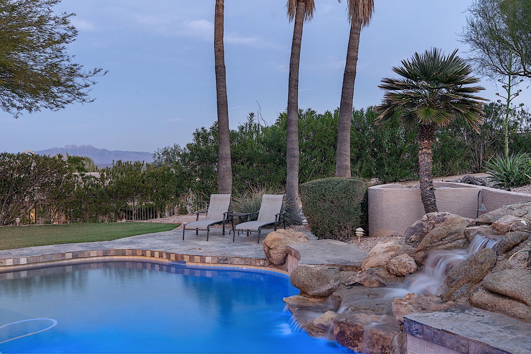 Chaise loungers next to the rock waterfall