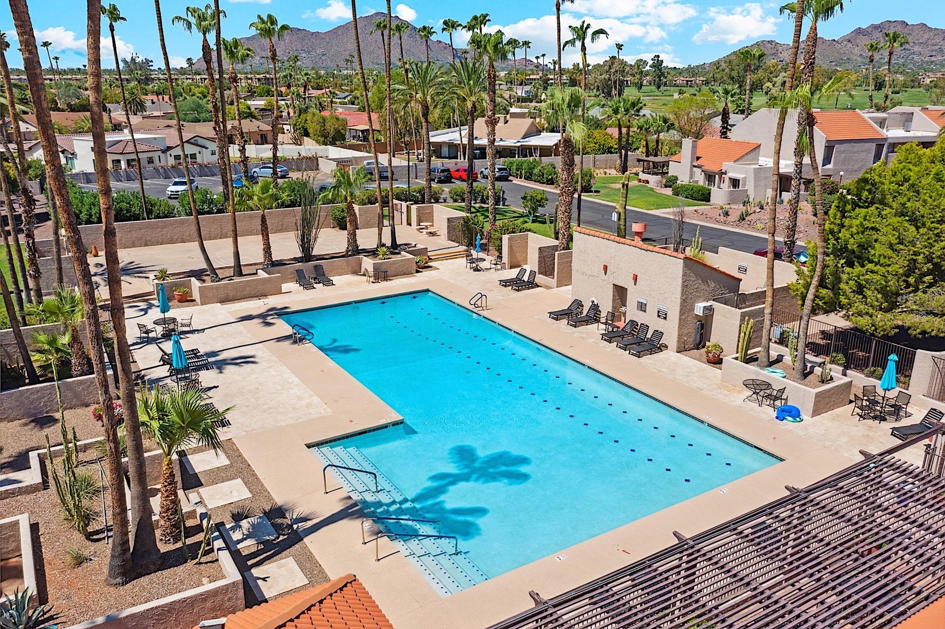 The wellkept community keeps loungers, pool umbrellas, and some bistro tables first come, first serve