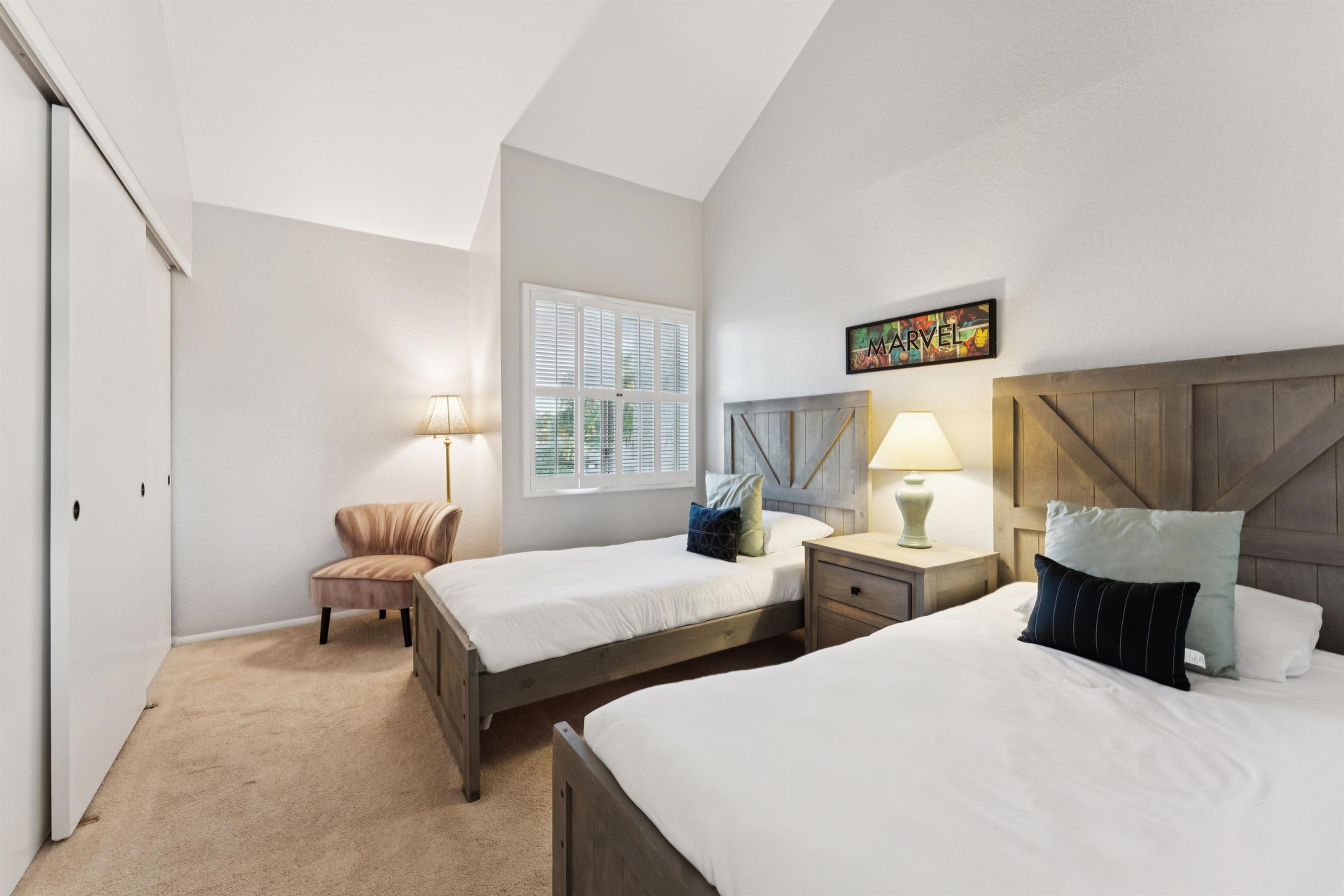 Guest Bedroom 2 equipped with twin beds and a nook perfect for readers