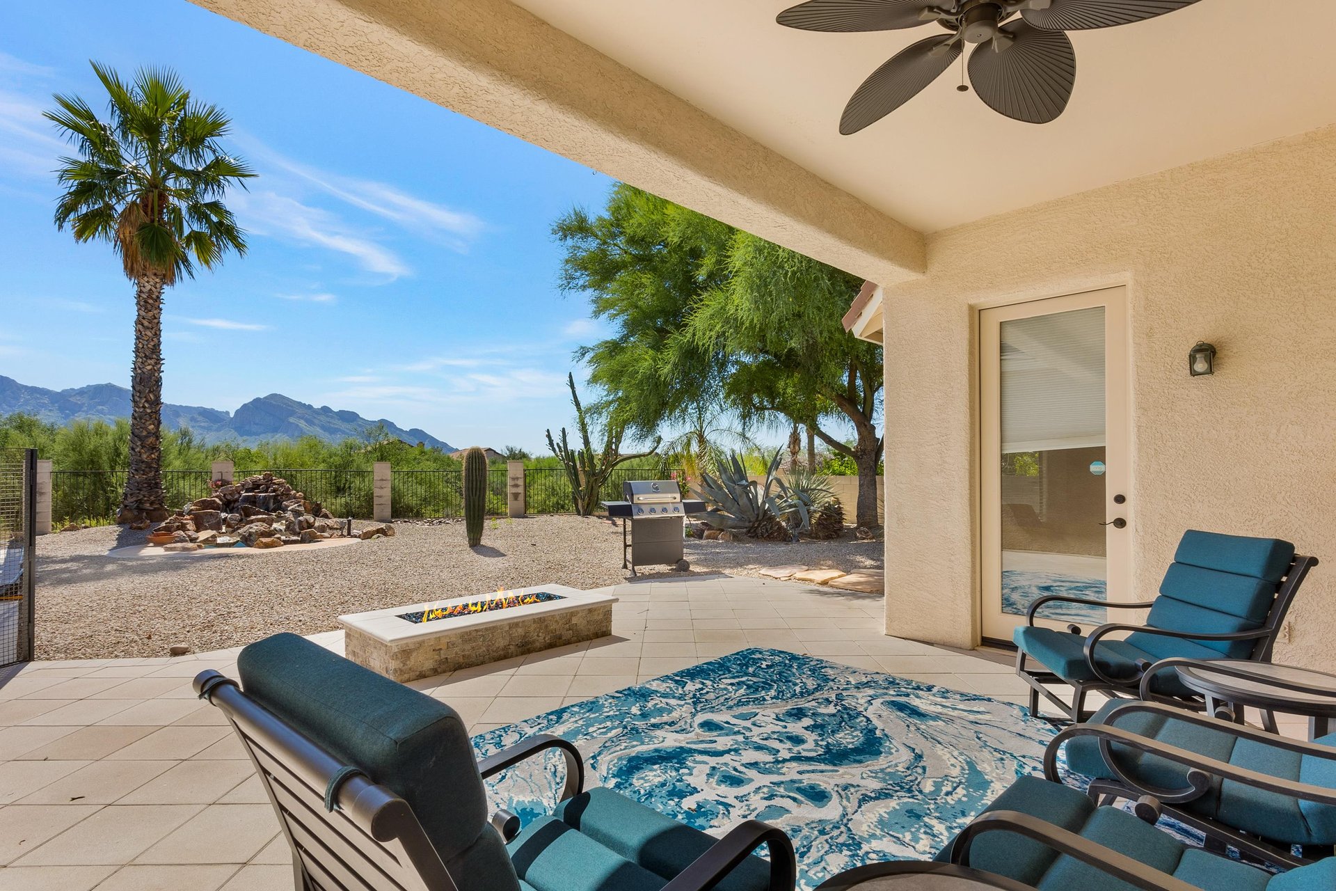 Covered patio with gas fireplace and stunning mountain views