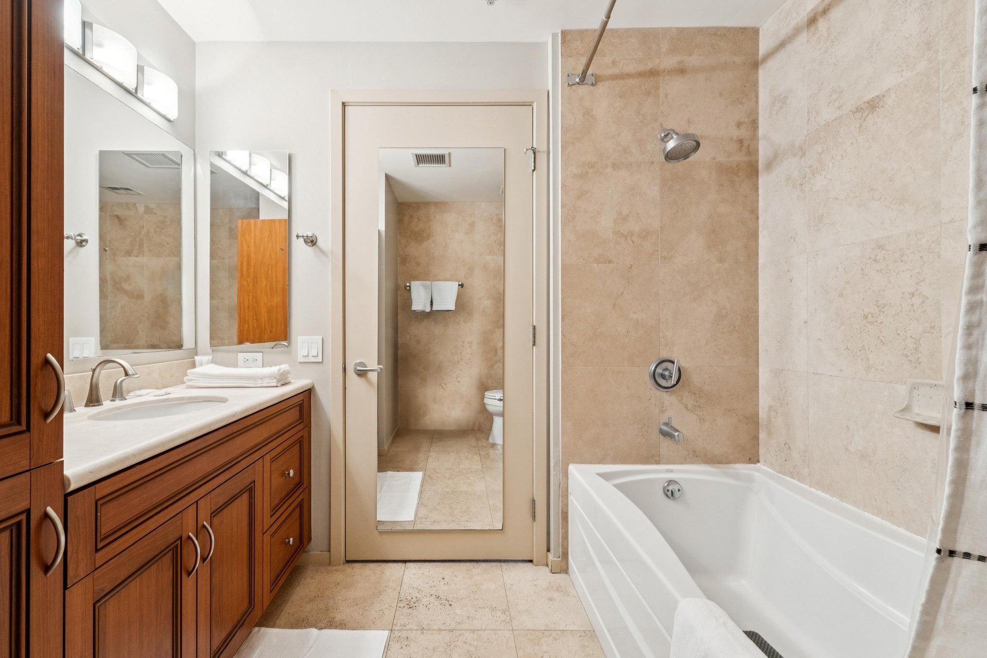 Full bathroom with shower, bathtub.