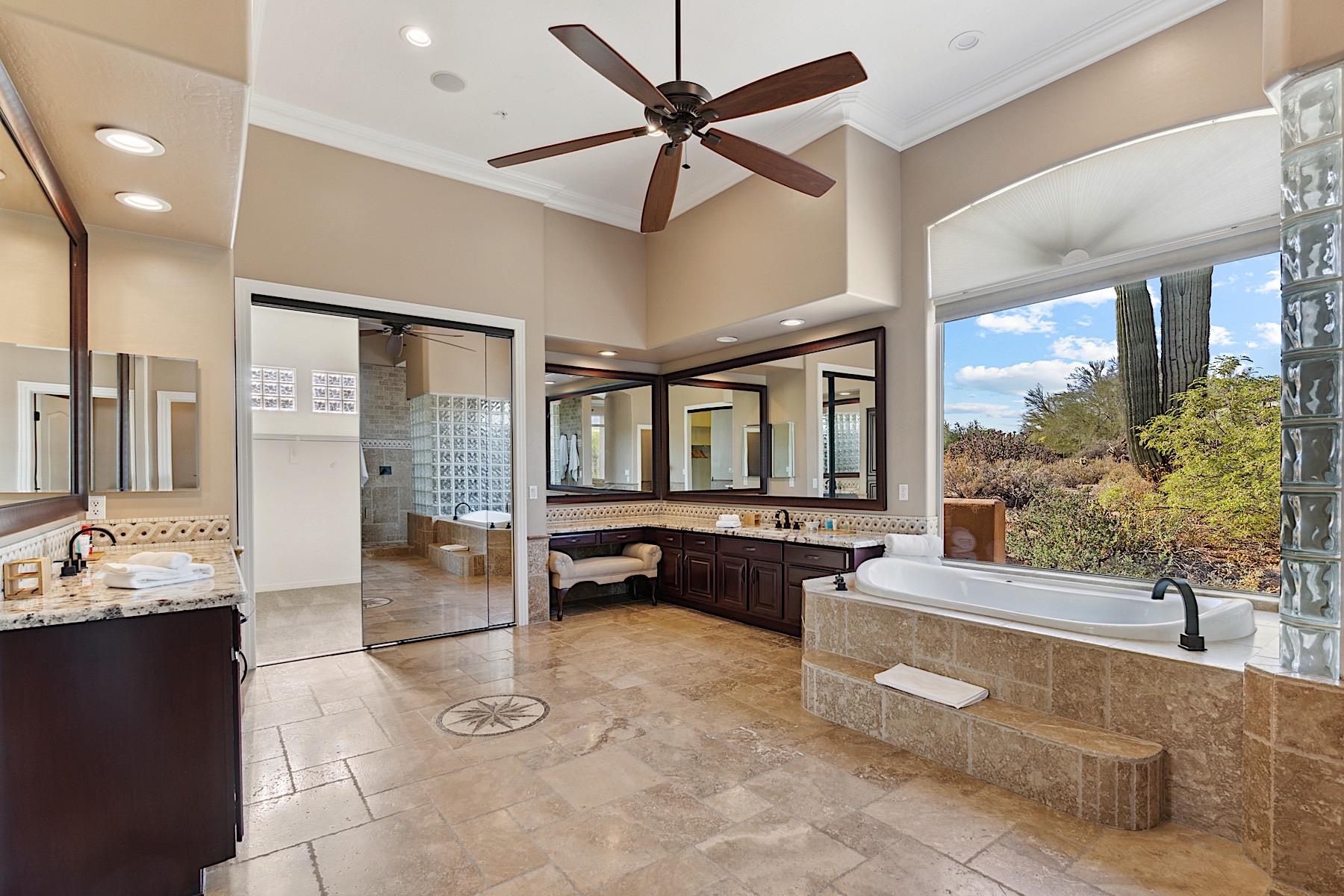 Large master bathroom w his  hers closets and vanity