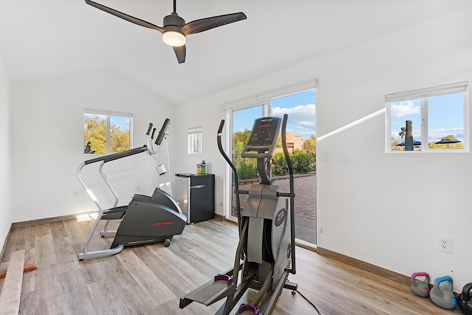 Gym w 2 ellipticals, free weights and yoga mats