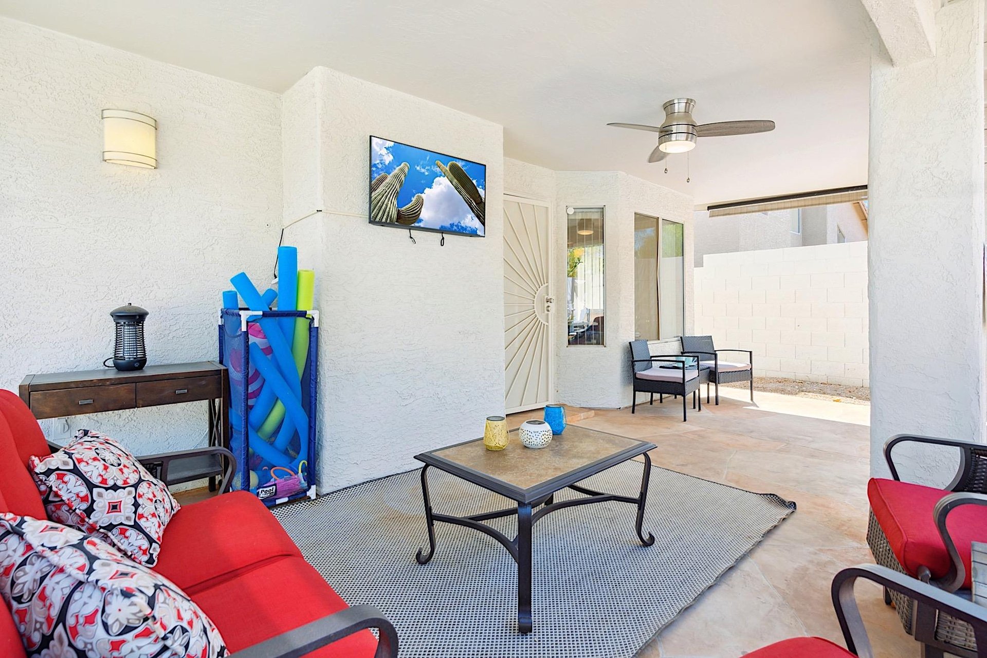 Covered patio  Conversation area w mounted Smart TV