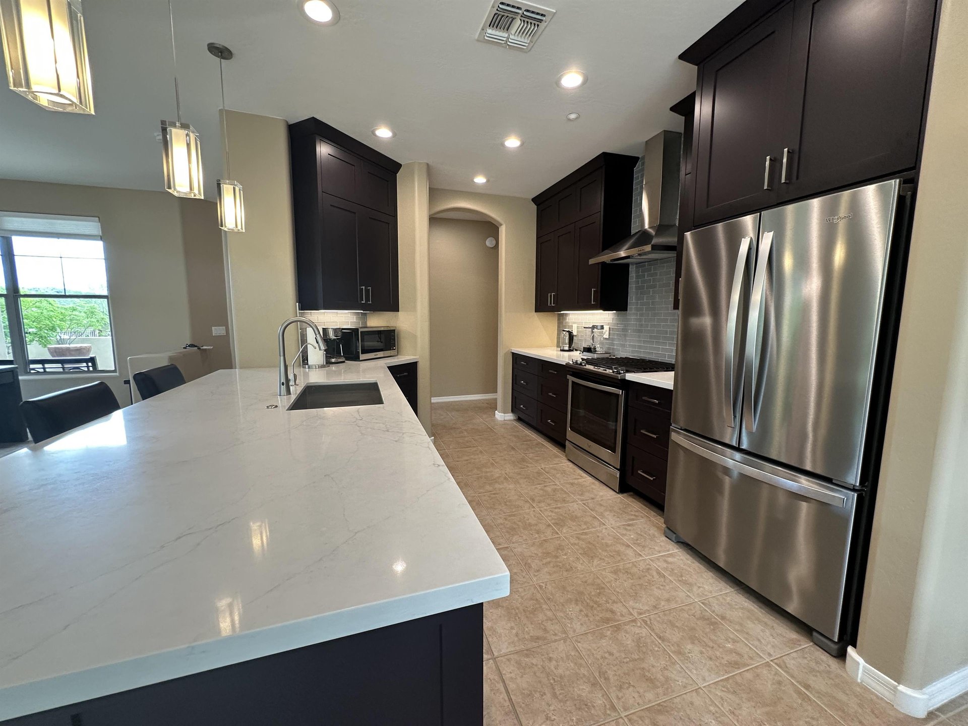 Large fridge with stainless steel appliances.