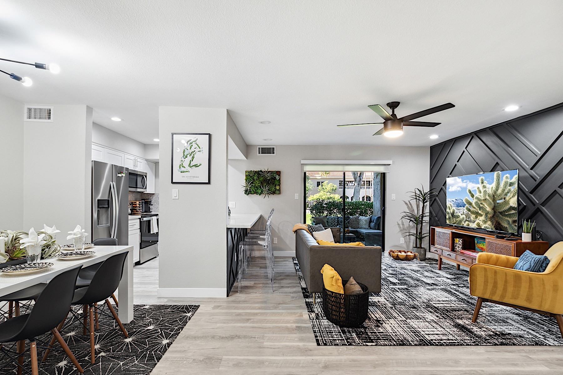 View of the layout Living room, breakfast bar, dining table and kitchen