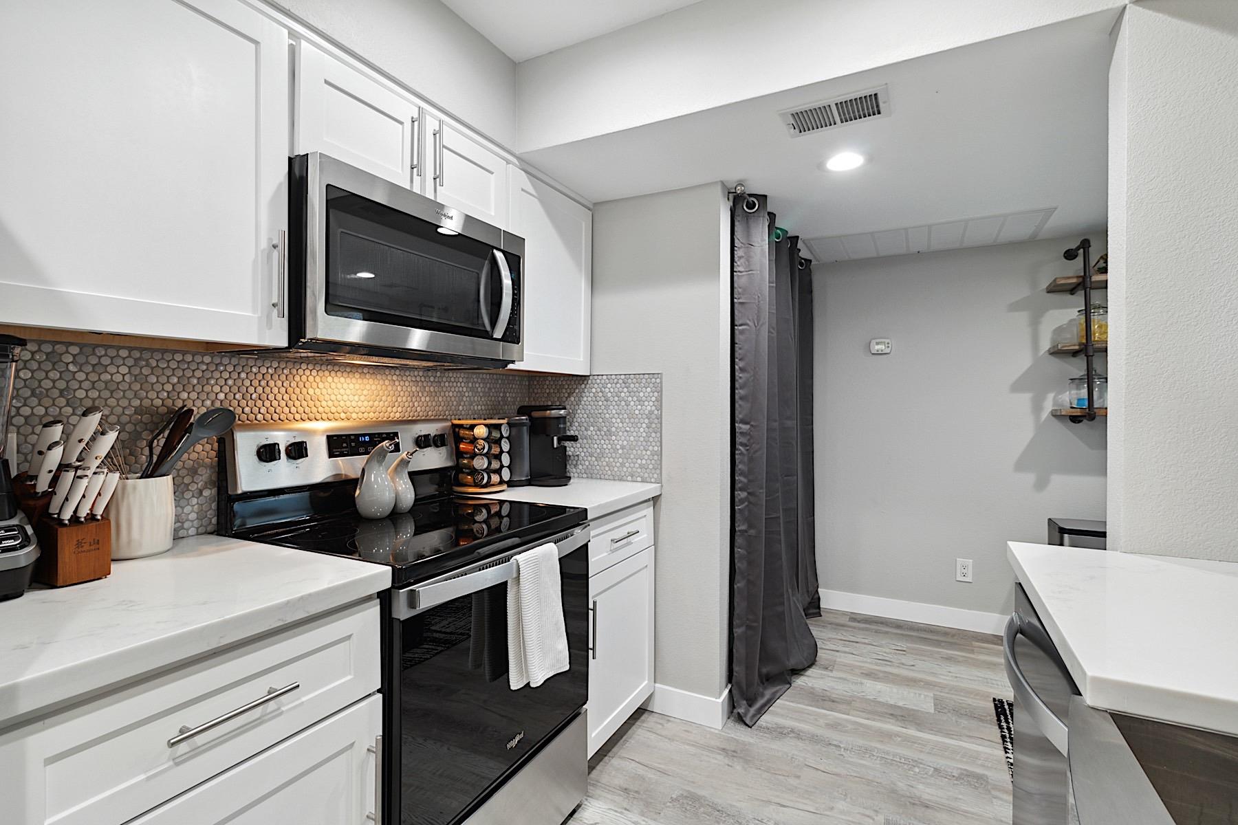 Kitchen looking into laundry room