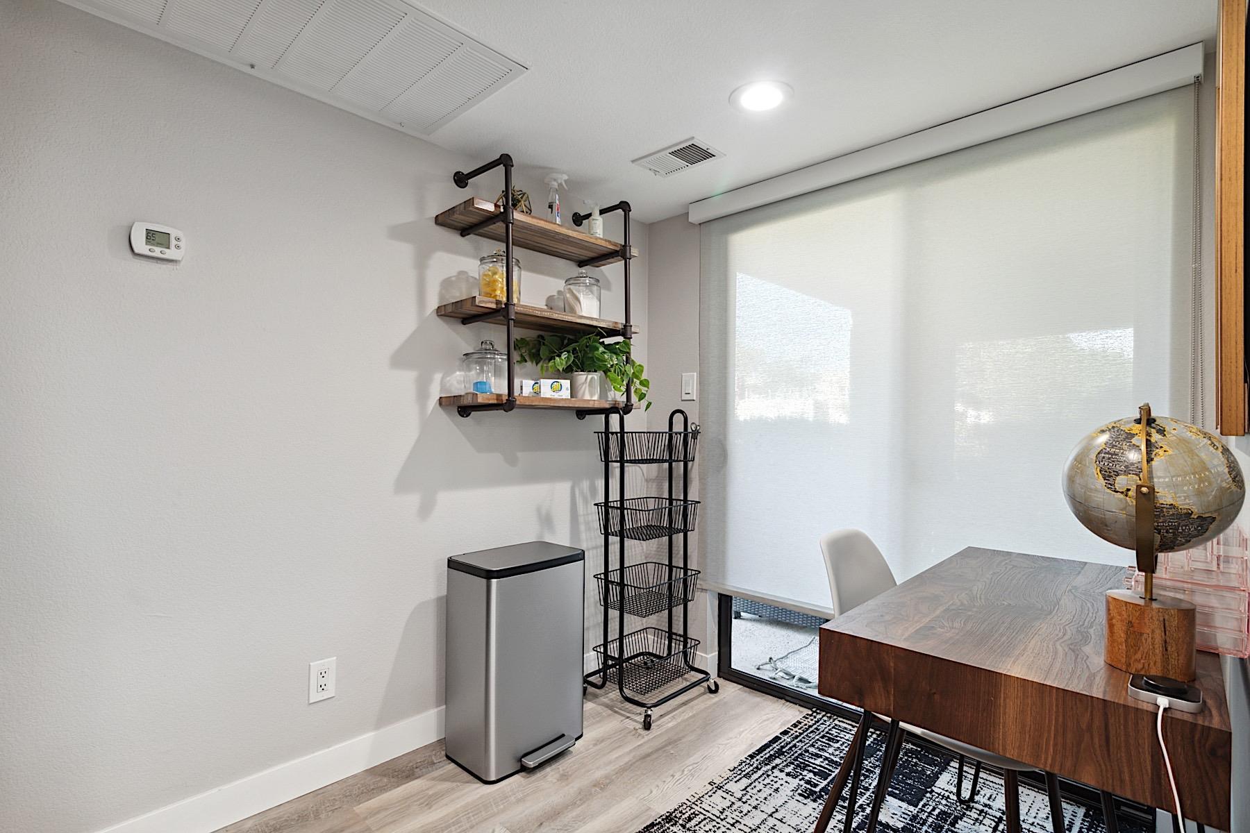 Desk workspace with chair and printer.