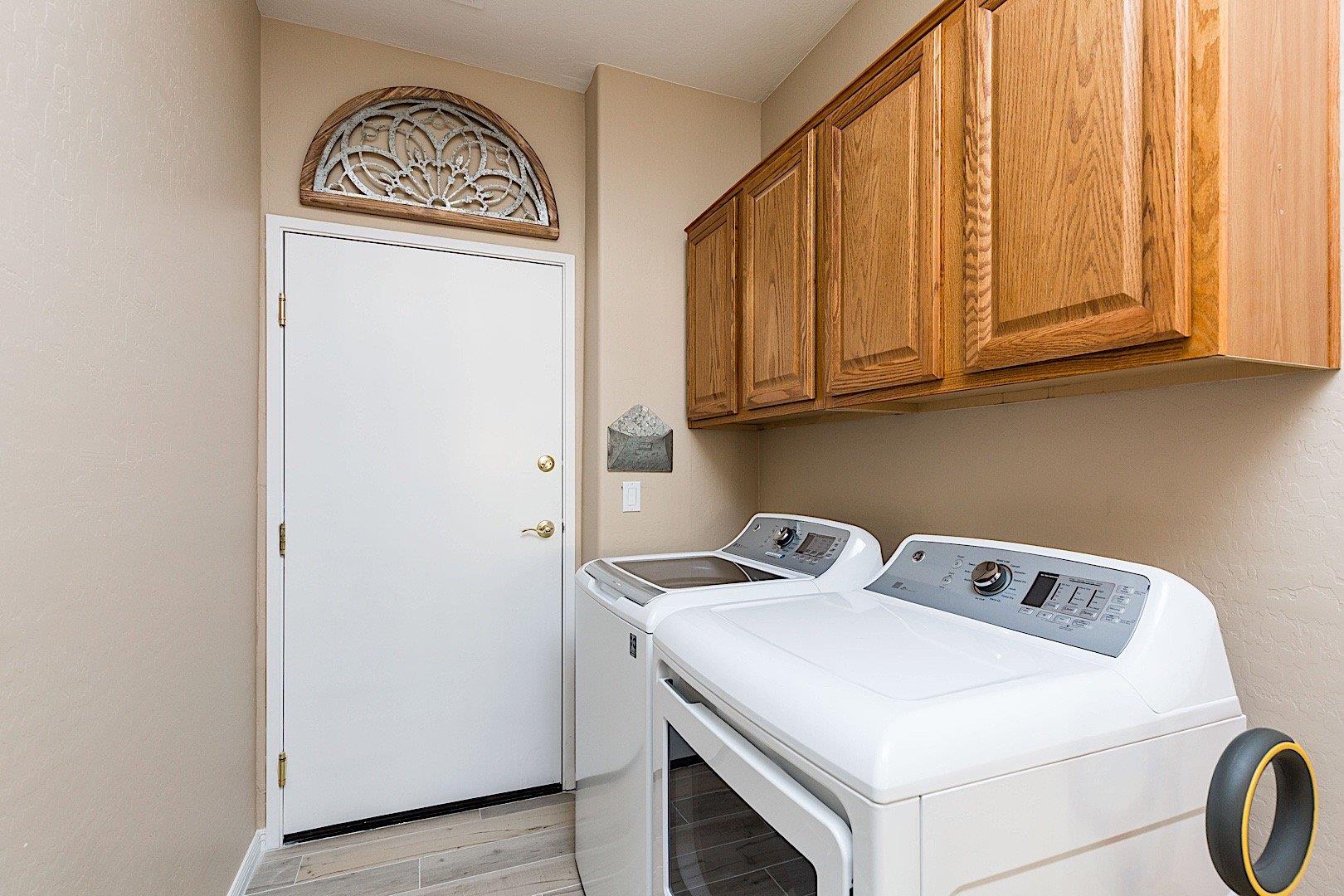 First floor laundry room leading out to the 2 car garage