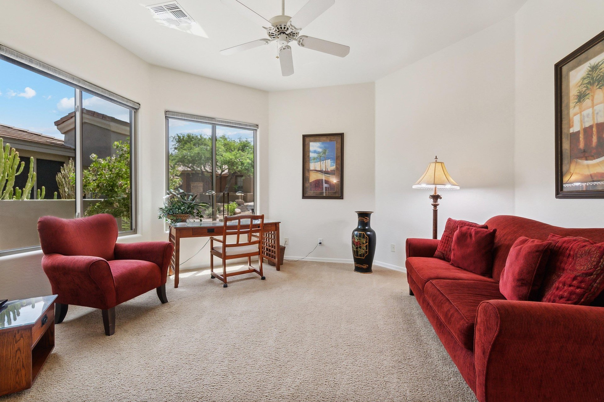 Den space is set up as an office space and lounge room