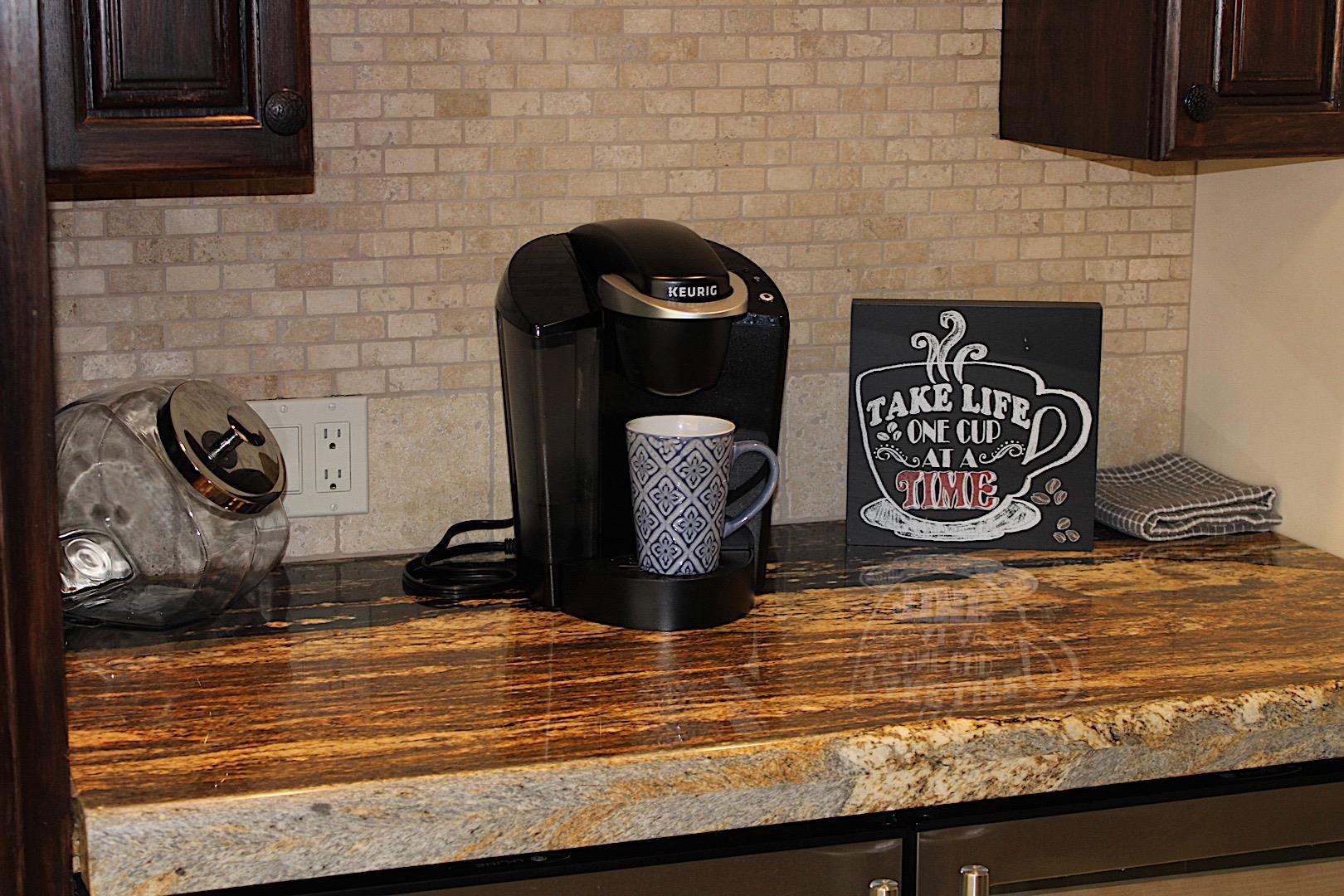 Grab yourself a nice cuppa at this coffee nook, or reach below into the wine fridge to grab a good time