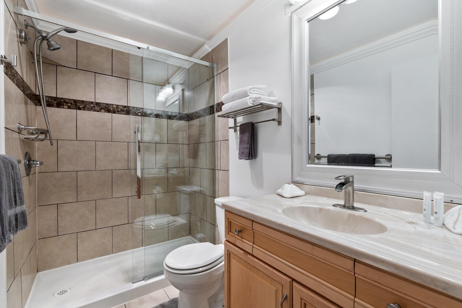 Bathroom two has a large walkin shower and a spacious vanity.