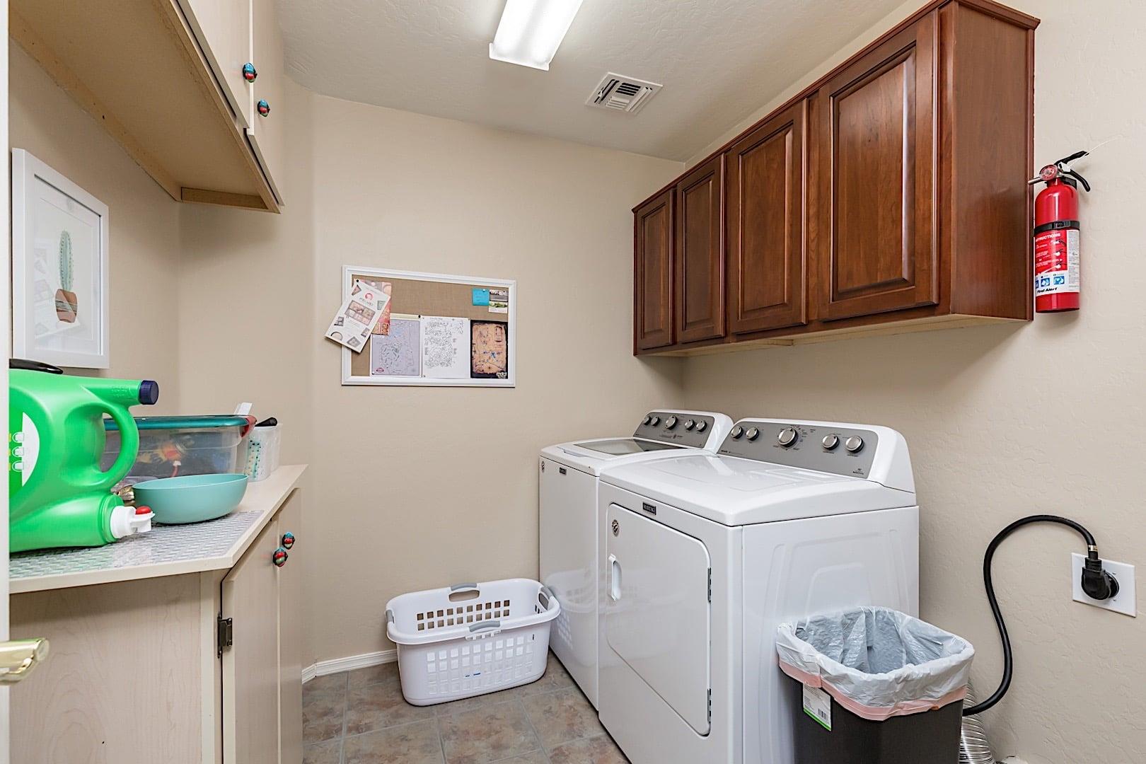 Full size washer and dryer in utility room