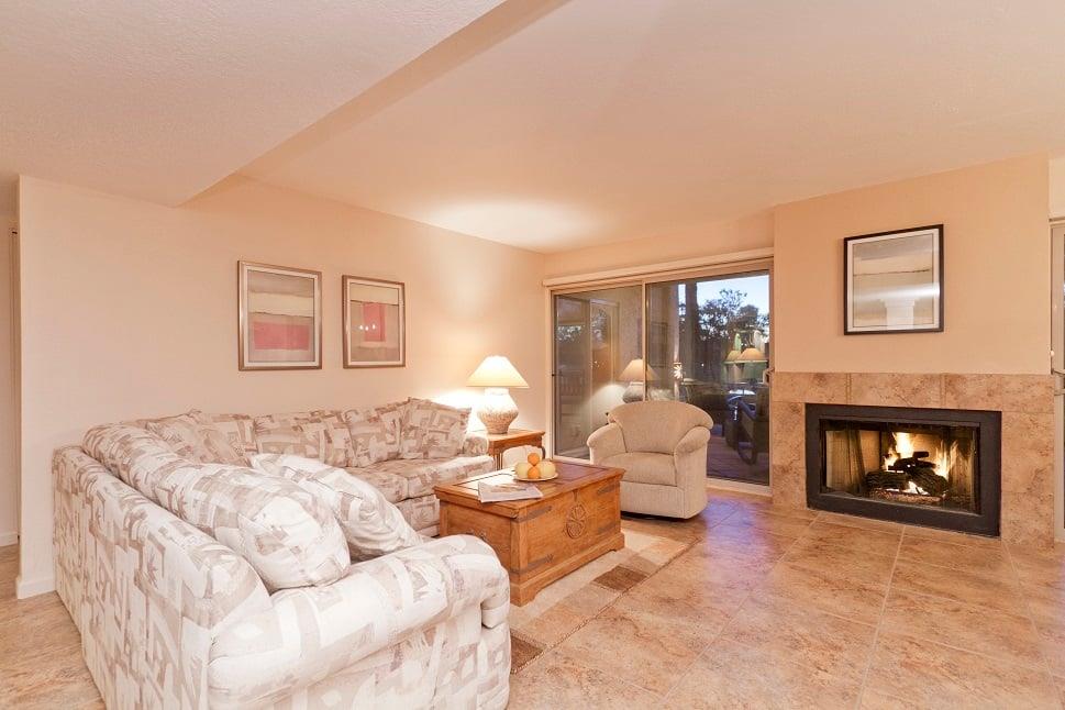 Living area with golf course views , water feature views, and fireplace. there are bald eagles soaring above regularly.