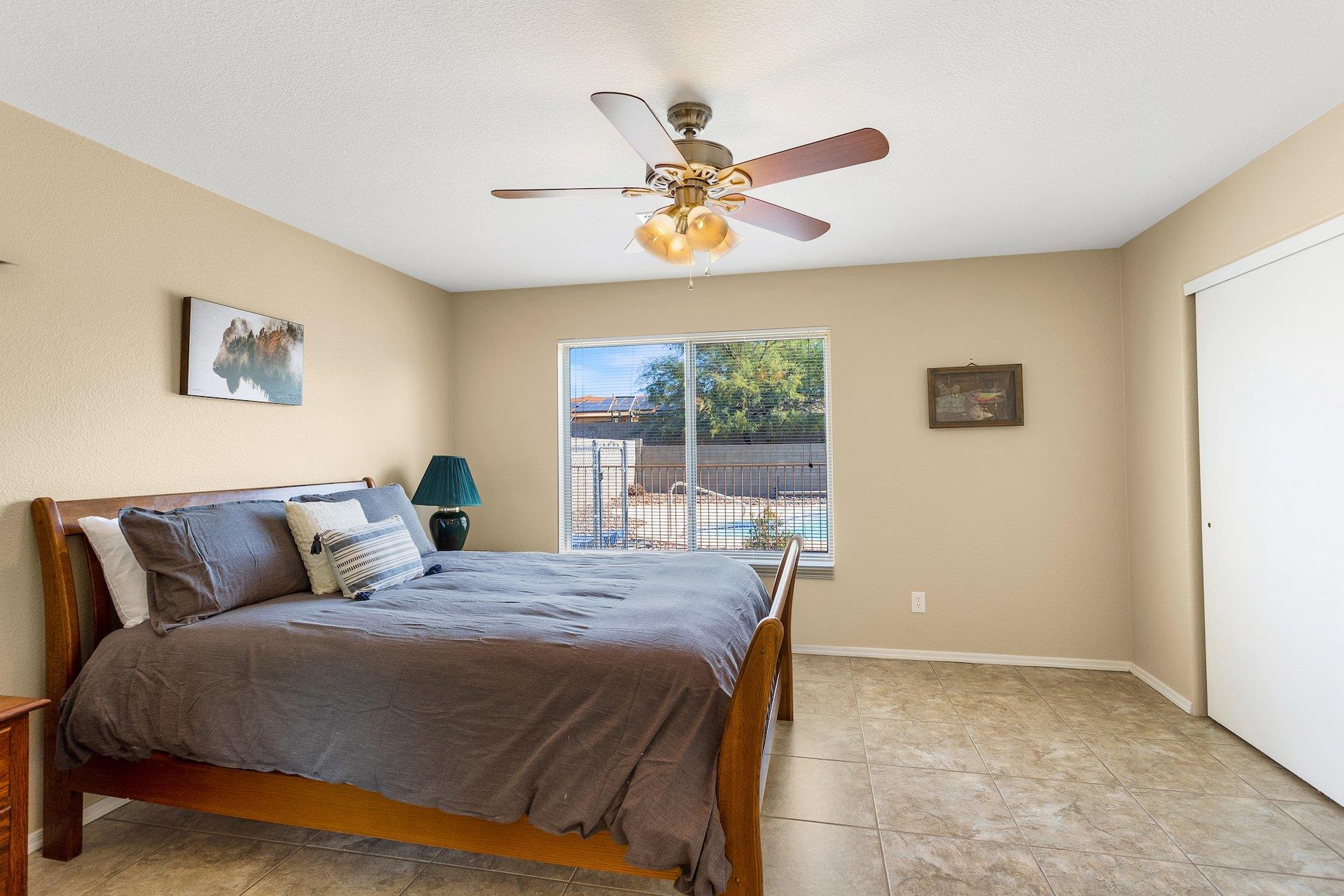 Master Bedroom Queen Bed and view of pool