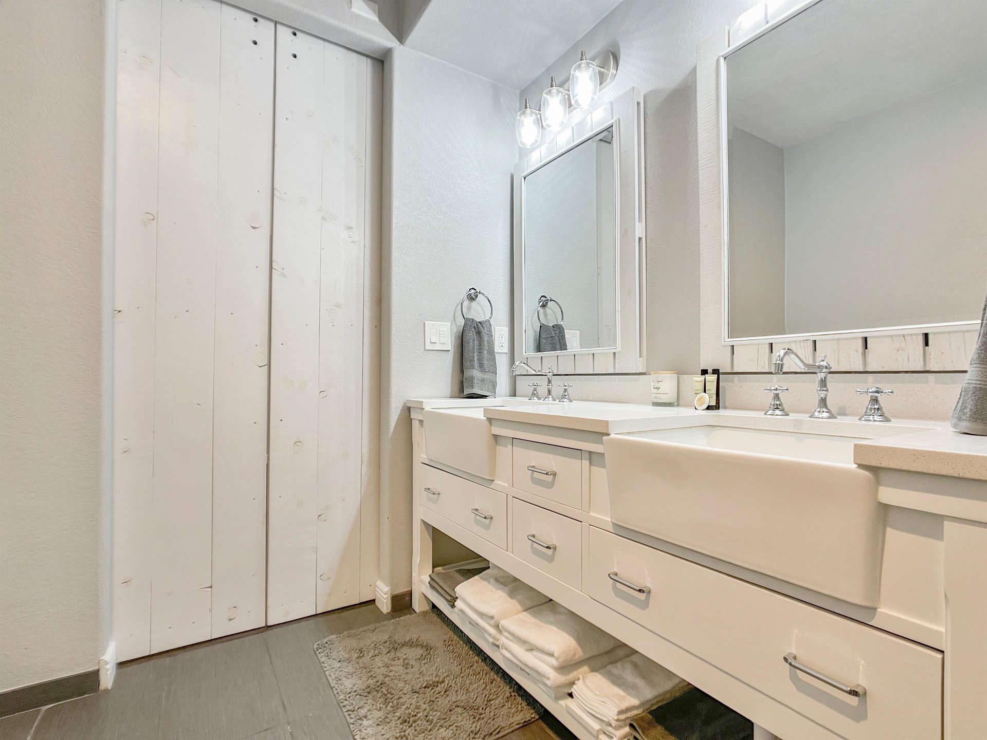 Double vanity with ample lighting in lux bathroom