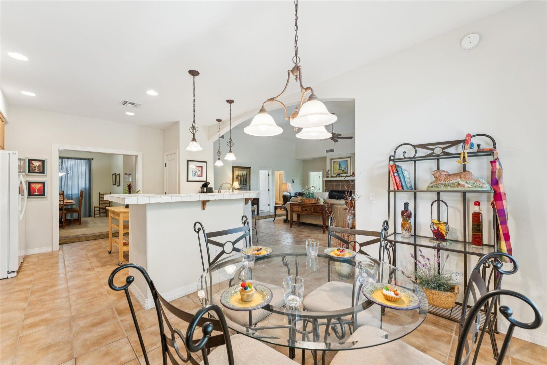 Enjoy a nice breakfast while enjoying the view of the backyard and birds at the bistro glass dining table.