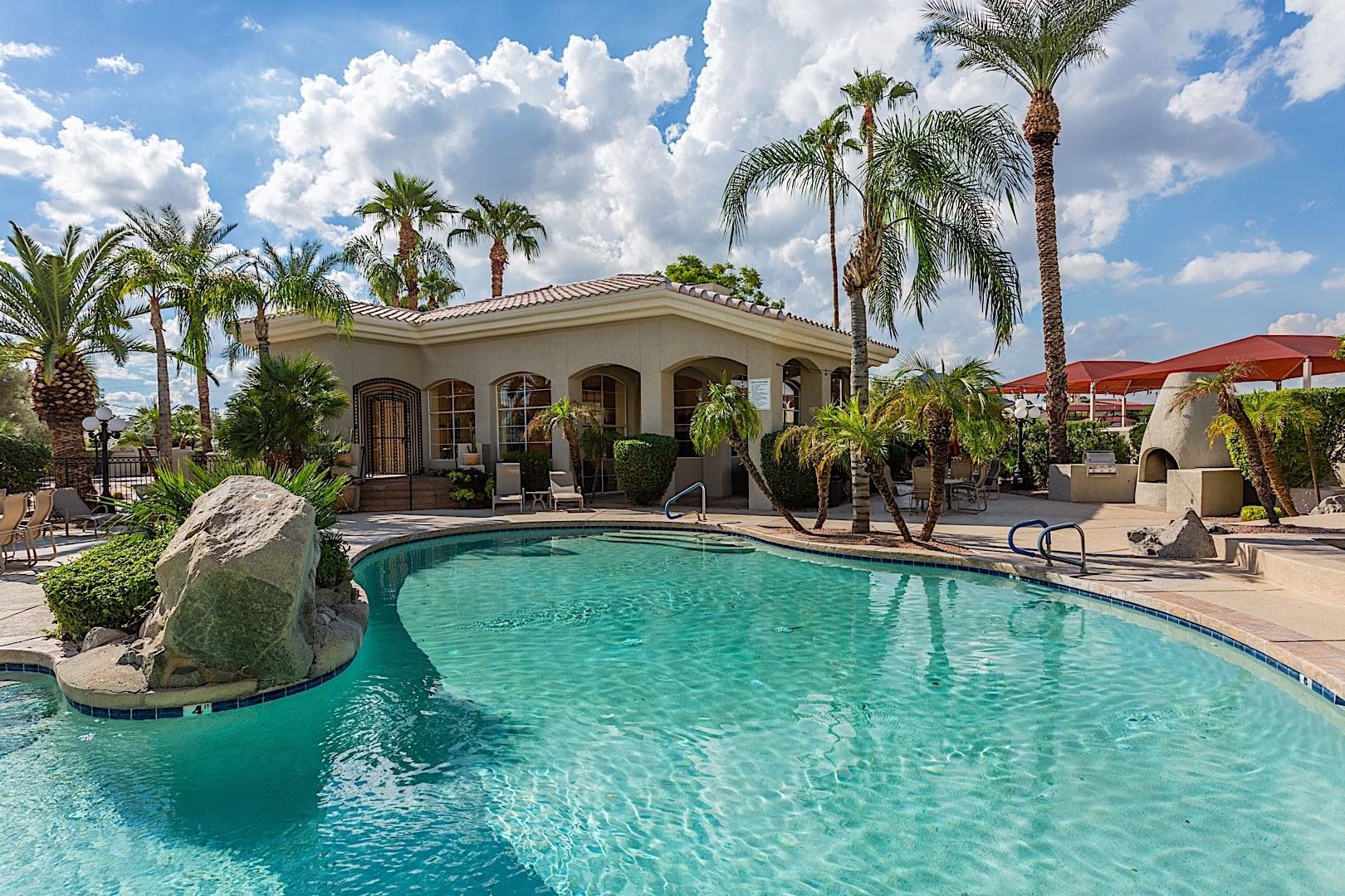 A pool with resort style landscaping