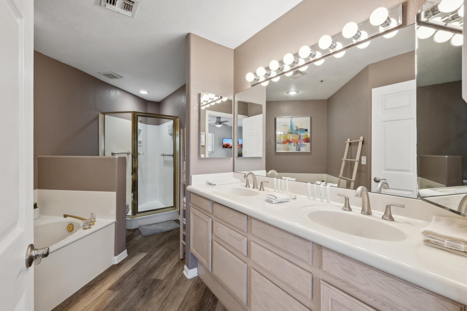 Soaking tub, standing shower, and a double vanity make this a great bathroom to share but only if you have to .