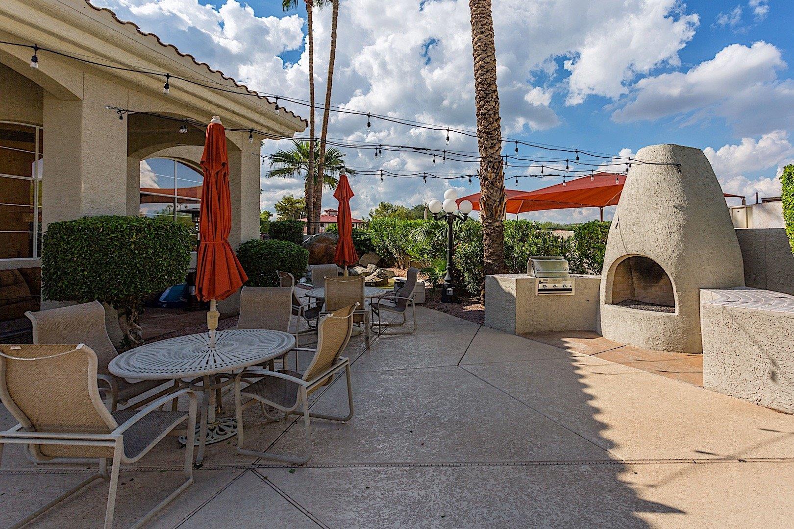 Community grilling, overhead tea lights, and an outdoor fireplace invite you to enjoy a warm evening outdoors