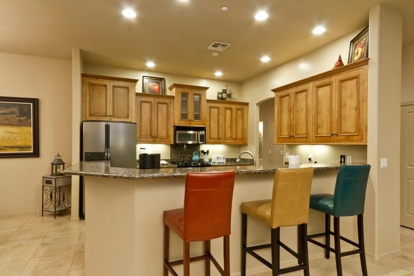 Take a seat on one of these colorful stools and watch the master work