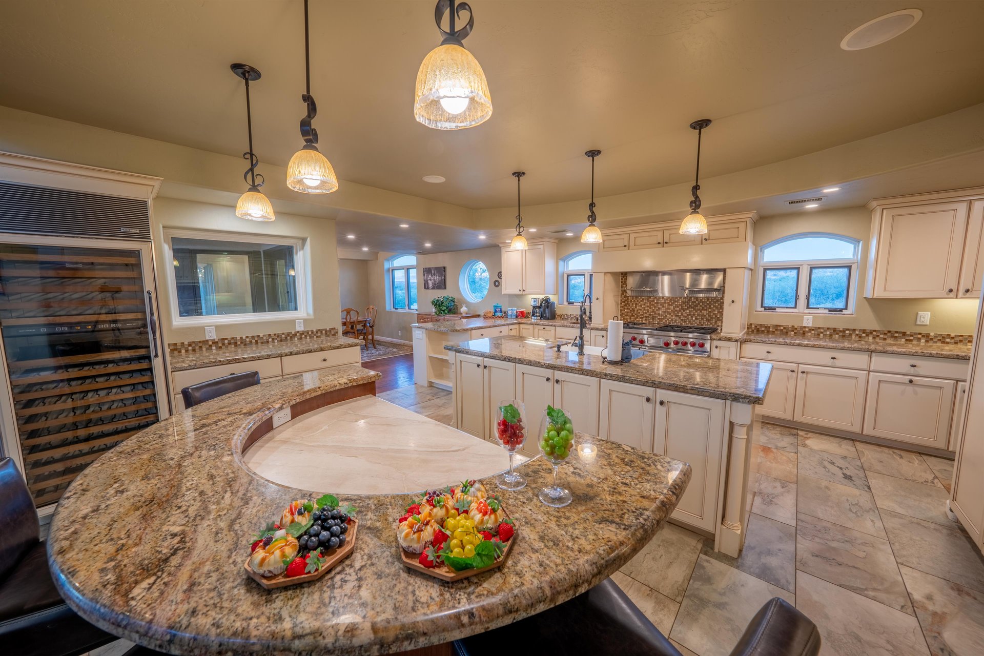 This Kitchens Custom Design Includes A Chefs Table That Is Perfect For Entertaining