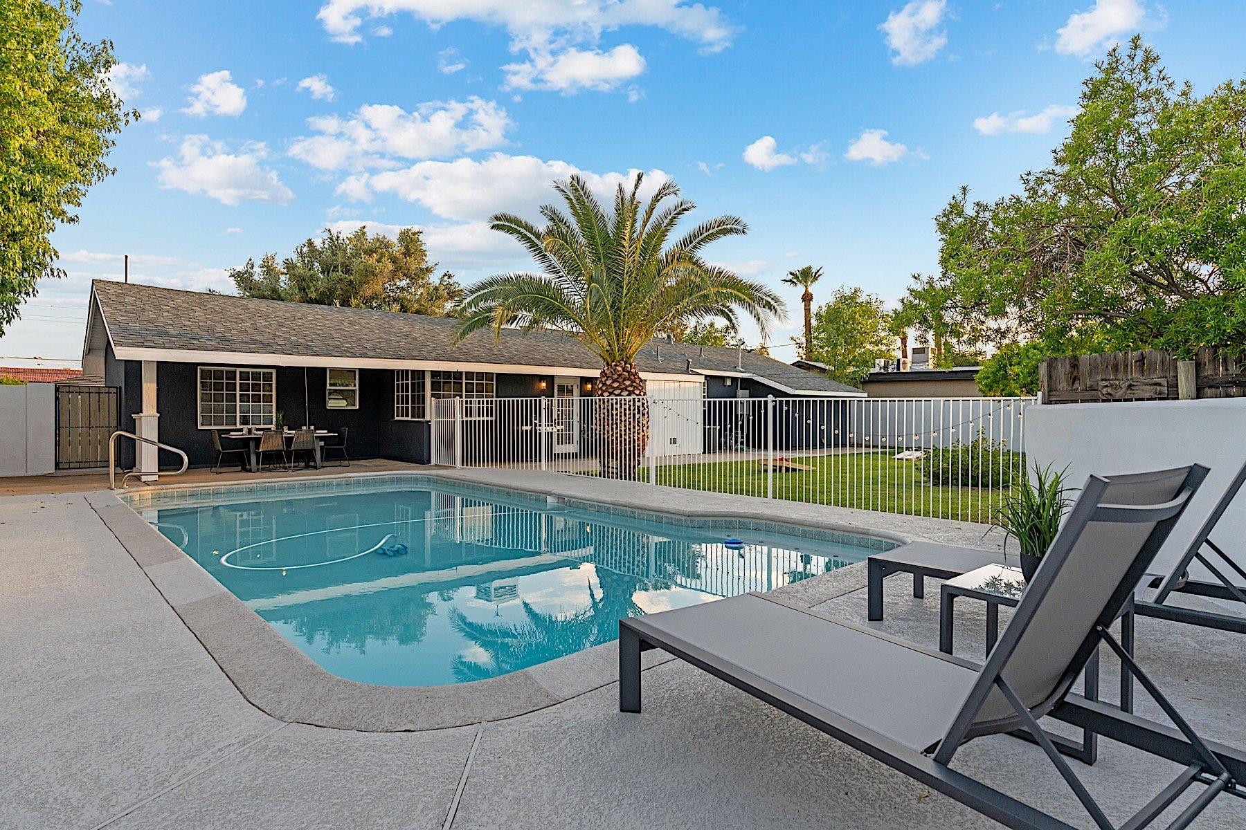 Beautiful pool accompanied by sun loungers